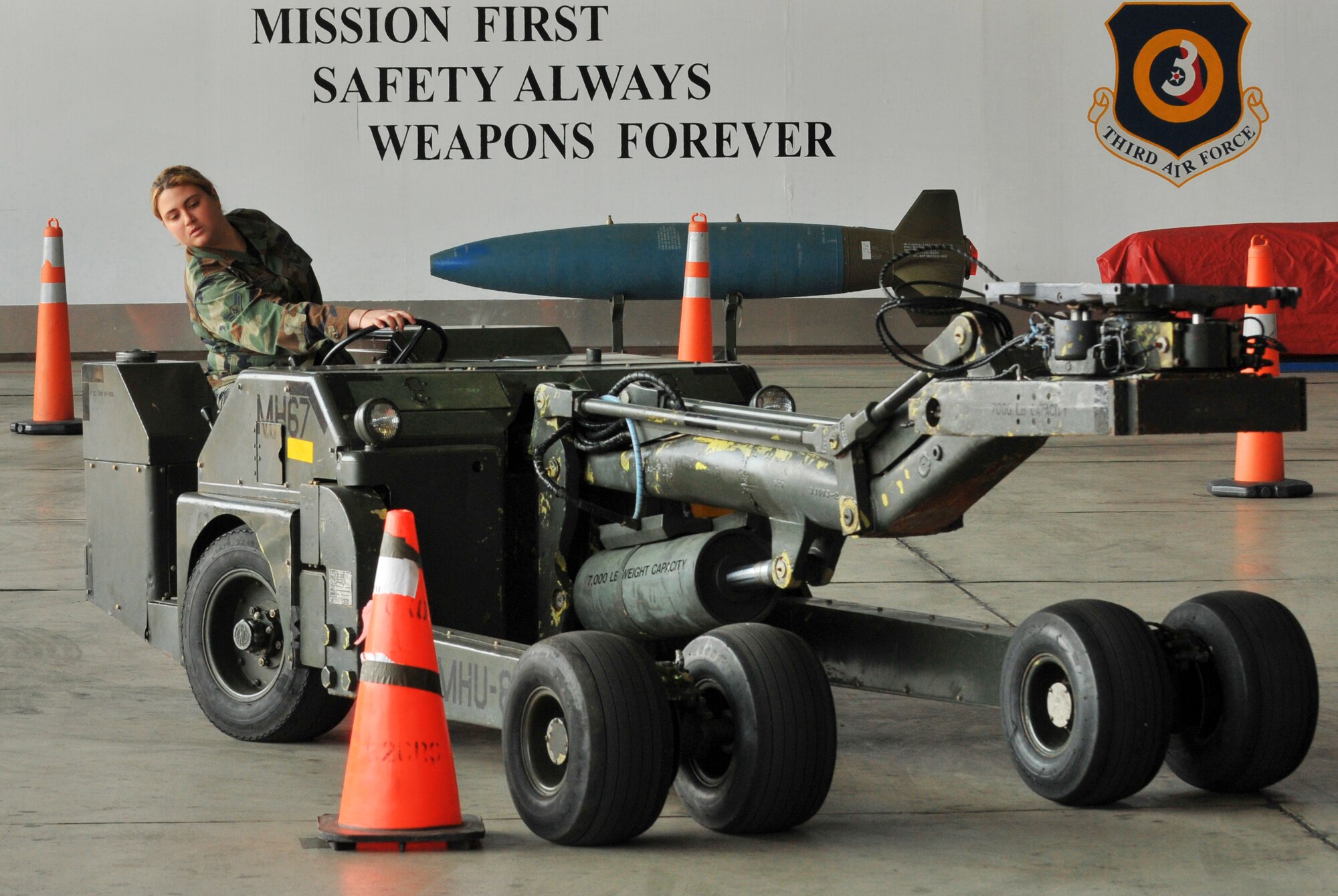 SPANGDAHLEM AIR BASE, Germany -- Airman 1st Class Heather Perez, 52nd Aircraft Maintenance Squadron weapons load crew team member, drives an MHU-83 jammer during the 52nd Fighter Wing Load Crew of the Quarter competition April 16. The MHU-83 jammer was chosen for the competition because of its challenging maneuverability as compared to other jammers. (U.S. Air Force photo/Airman 1st Class Nick Wilson)