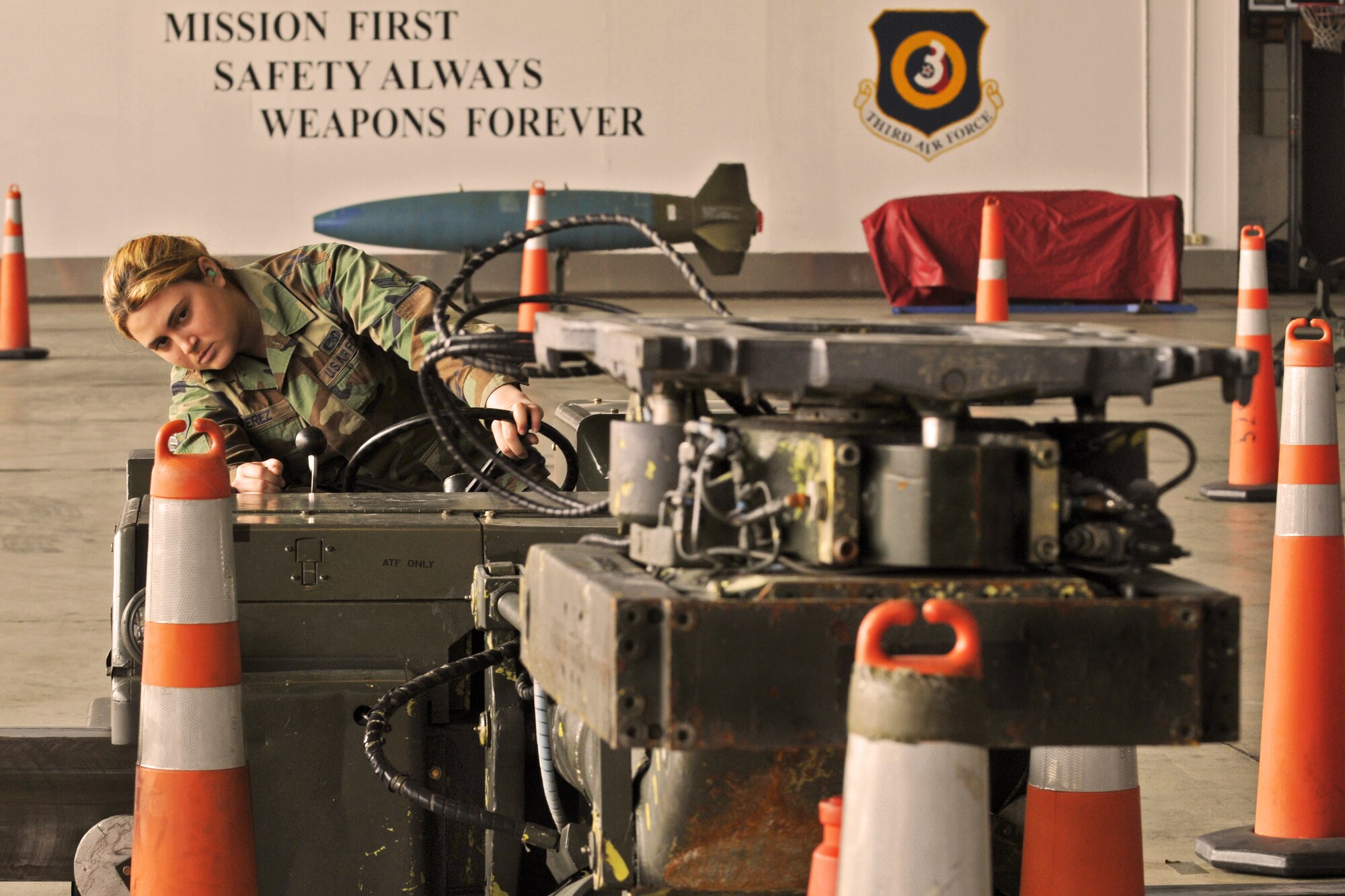 SPANGDAHLEM AIR BASE, Germany -- Airman 1st Class Heather Perez, 52nd Aircraft Maintenance Squadron weapons load crew team member, drives an MHU-83 jammer during the 52nd Fighter Wing Load Crew of the Quarter competition April 16. The MHU-83 jammer was chosen for the competition because of its challenging maneuverability as compared to other jammers. (U.S. Air Force photo/Airman 1st Class Nick Wilson)