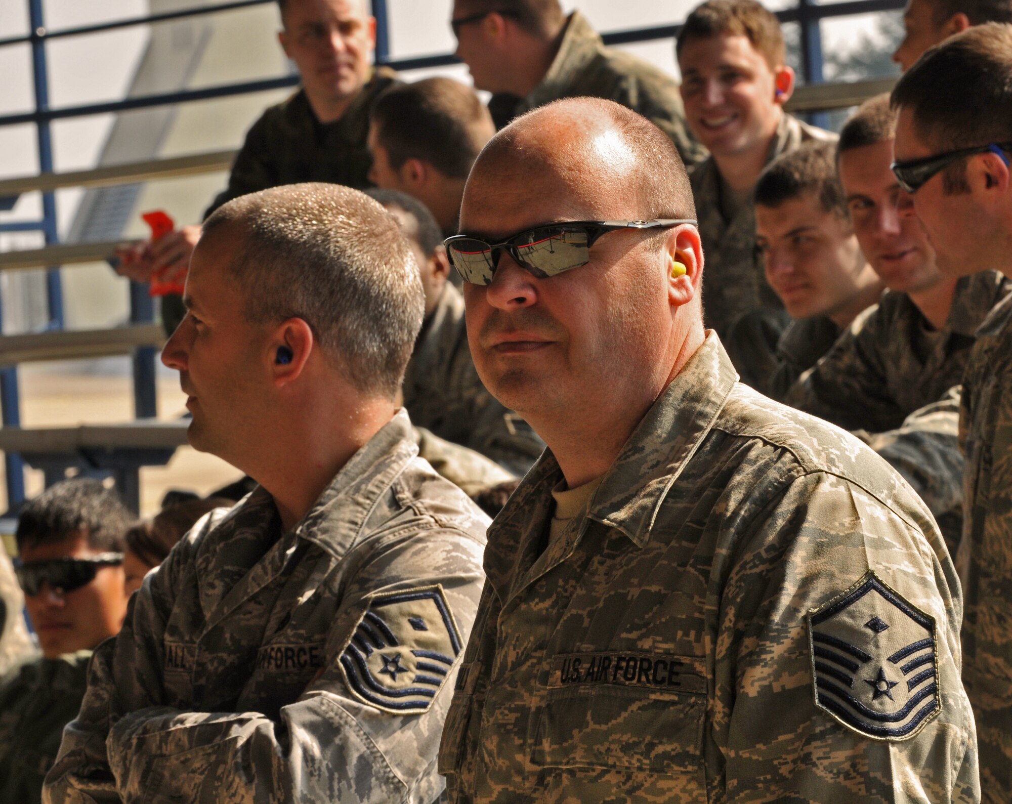 SPANGDAHLEM AIR BASE, Germany -- Master Sgt. Paul Connelly, right, 52nd Aircraft Maintenance Squadron first sergeant, watches the 52nd Fighter Wing Load Crew of the Quarter competition April 16. The competition challenged Airmen from the 52nd AMS to safely and efficiently load munitions onto their aircraft. (U.S. Air Force photo/Airman 1st Class Nick Wilson)