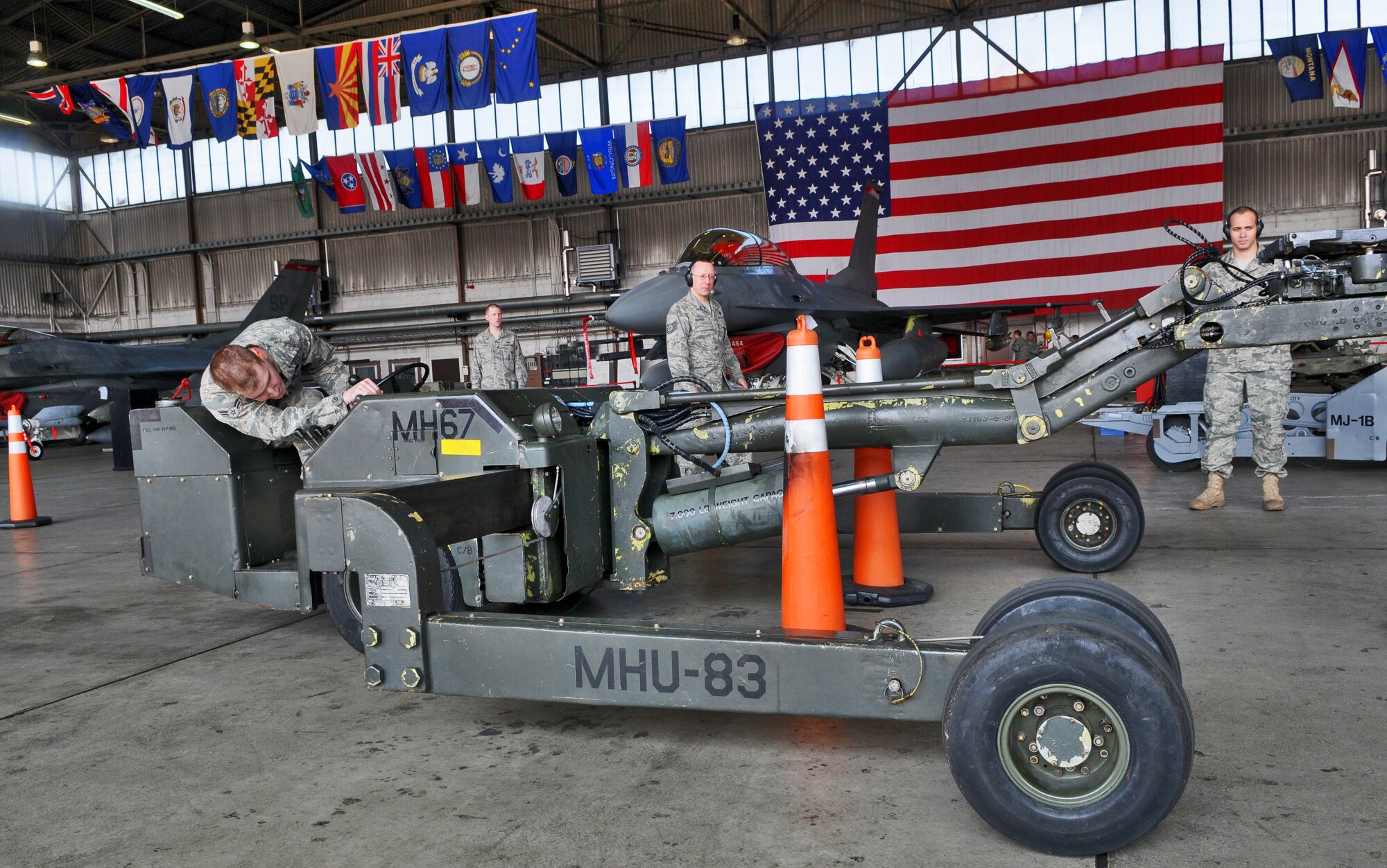 SPANGDAHLEM AIR BASE, Germany -- Airman 1st Class Zachary Rubinstein, 52nd Aircraft Maintenance Squadron weapons load crew team member, ensures the MHU-83 jammer boom is in the correct position during the 52nd Fighter Wing Load Crew of the Quarter competition April 16. The MHU-83 jammer was chosen for the competition because of its challenging maneuverability as compared to other jammers. Airman Rubinstein bested two other Airmen and was crowned 52nd FW Jammer Driver of the Quarter. (U.S. Air Force photo/Airman 1st Class Nick Wilson)