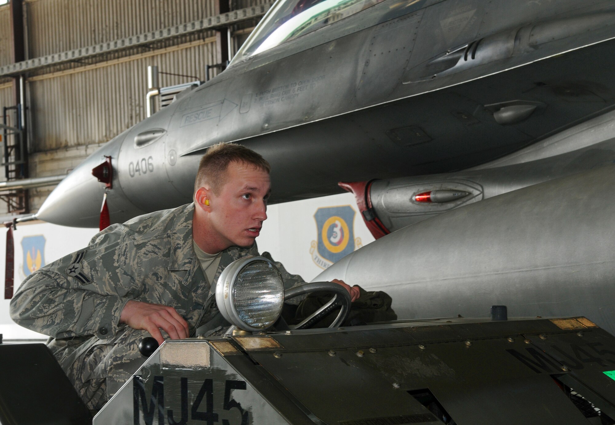 SPANGDAHLEM AIR BASE, Germany – Airman 1st Class Nicholas Reese, 23rd Aircraft Maintenance Unit weapons load crew team member, loads munitions onto an F-16 Fighting Falcon during the 52nd Fighter Wing Load Crew of the Quarter competition April 16. The competition pitted three of the wing’s best load crews against each other to crown the best for the first quarter of 2010. The competition consisted of a dress and appearance evaluation and composite tool-box inspection. Airman Reese was a member of the 23rd AMU’s three-man team that won the competition. (U.S. Air Force photo/Airman 1st Class Nick Wilson)