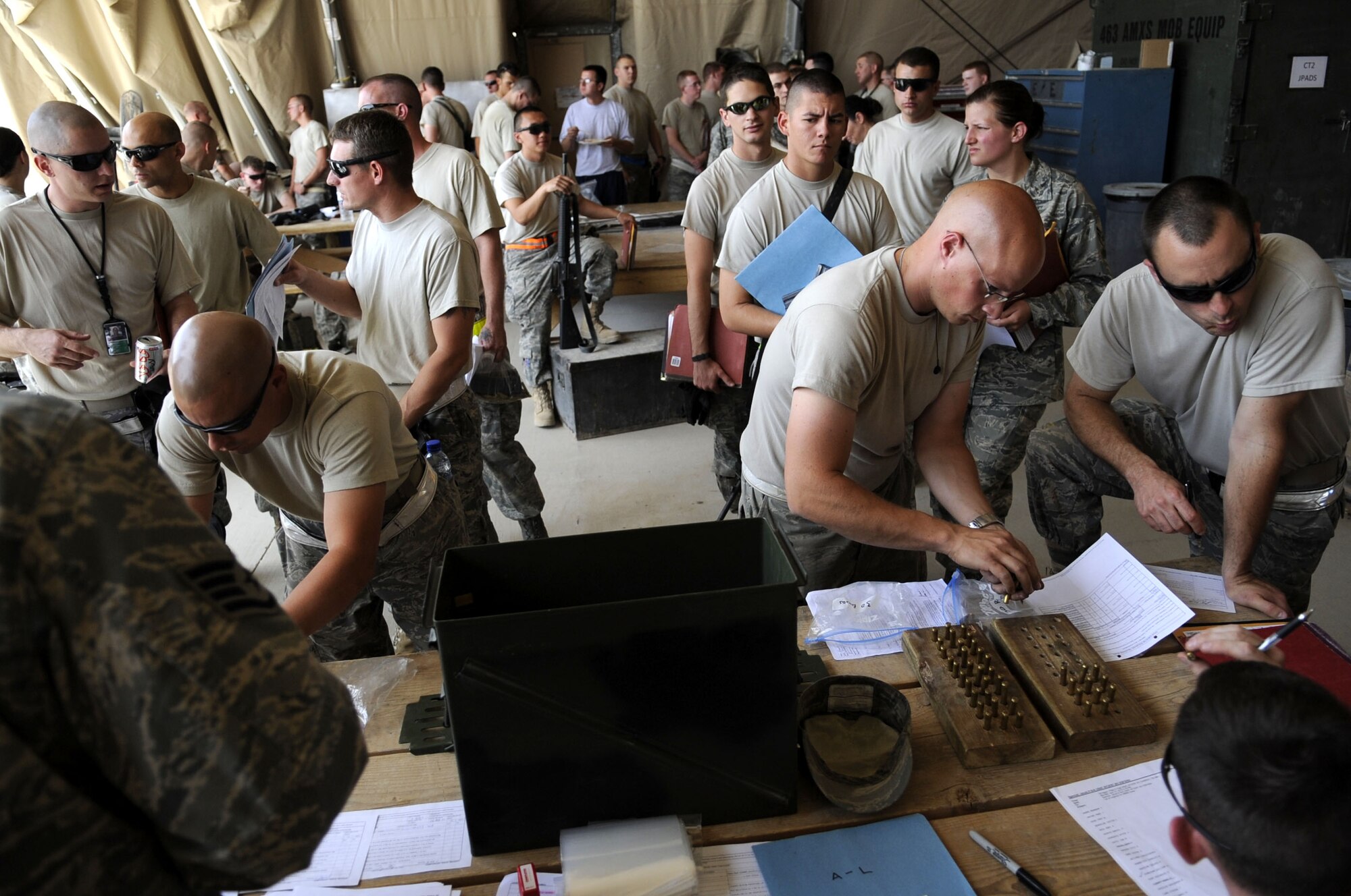 The Combat Arms Training and Maintenance Team from the 451st Expeditionary Security Forces Squadron, visited to the 451st Expeditionary Aircraft Maintenance Squadron to receive and issue ammunition with more than 40 members of the unit. (U.S. Air Force photo by Senior Airman Nancy Hooks/Released) 
