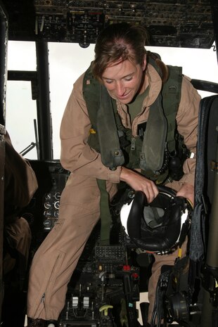 Capt. Eileen C. Donovan, a CH-46E "Sea Knight" pilot with Marine Medium Helicopter Squadron 166, Marine Aircraft Group 16, 3rd Marine Aircraft Wing, wraps up her flight in  a helicopter that her father flew in 41 years ago, while visiting the air station, April 21. Donovan has been waiting for a moment like this for more than two years. ::r::::n::(Official U.S. Marine Corps photo by Cpl. Christopher O'Quin/Released)