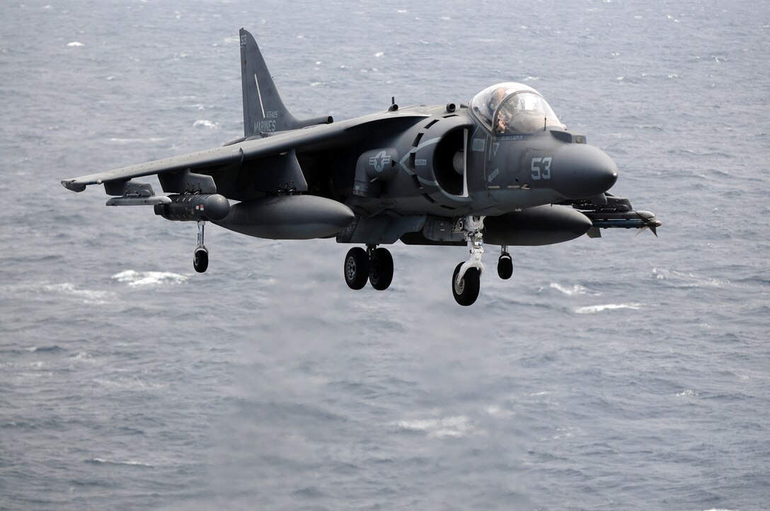 British Royal Air Force Flight Lt. Dougie McKay, an exchange pilot with Marine Attack Squadron 311, flies in to land on the deck of the USS Peleliu April 21, 2010, during the squadron’s final predeployment exercise off the coast of California. Six AV-8B Harriers and approximately 80 squadron Marines left Yuma April 15 to participate in their third and final predeployment training evolution. The exercise, which began April 16 and is scheduled to end April 27, included the entire 15th Marine Expeditionary Unit. The squadron is slated to deploy to the Pacific and Indian Oceans with the 15th MEU in May. The main body of the squadron deployed to Japan aboard the USS Essex with the 31st MEU in January. The last time the squadron deployed with the 15th MEU was in 2008.