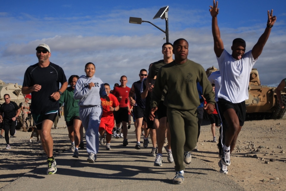 Combat Center employees show enthusiasm at the start of the 5k Earth Day Challenge Run in support of Earth Day April 22 at the Del Valle track.