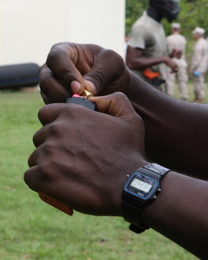 Antigua Police Department Sgt. Conrad Anthony loads a magazine with 9mm simulation rounds for an action/reaction drill as part of Tradewinds 2010.Tradewinds is a Chaiman of the Joint Chiefs directed, U.S. Southern Command sponsored annual exercise that is conducted with the Caribbean Basin Partner Nations, designed to improve cooperation with the partner nations in responding to regional security threats.