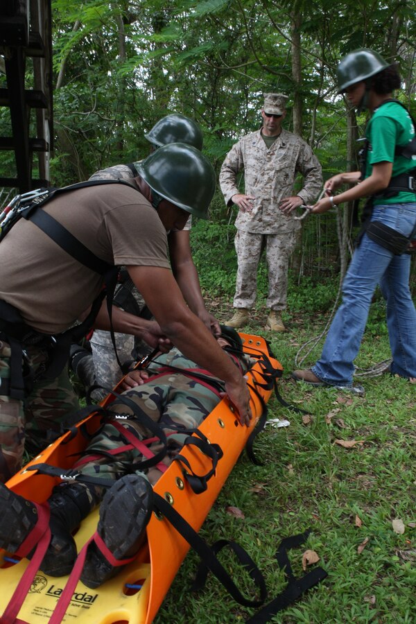 Staff Sgt. John Caret, Instructor, Enviromental Services Detachment, Marine Forces Reserve (MARFORRES) conducts confined space rescue training with members of the Dominican Navy, the Belize Defense Force, and the Belize Police as part of Tradewinds 2010.Tradewinds is a Chaiman of the Joint Chiefs directed, U.S. Southern Command sponsored annual exercise that is conducted with the Caribbean Basin Partner Nations, designed to improve cooperation with the partner nations in responding to regional security threats.