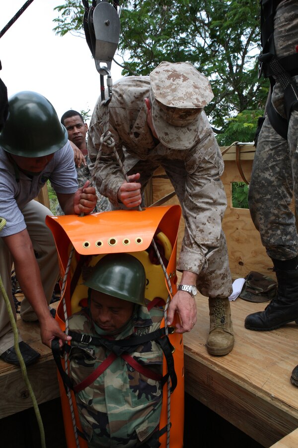 Sgt. Christian Cortelli, Instructor, Enviromental Services Detachment, Marine Forces Reserve (MARFORRES) conducts confined space rescue training with members of the Dominican Navy, the Belize Defense Force, and the Belize Police as part of Tradewinds 2010.Tradewinds is a Chairman of the Joint Chiefs directed, U.S. Southern Command sponsored annual exercise that is conducted with the Caribbean Basin Partner Nations, designed to improve cooperation with the partner nations in responding to regional security threats.