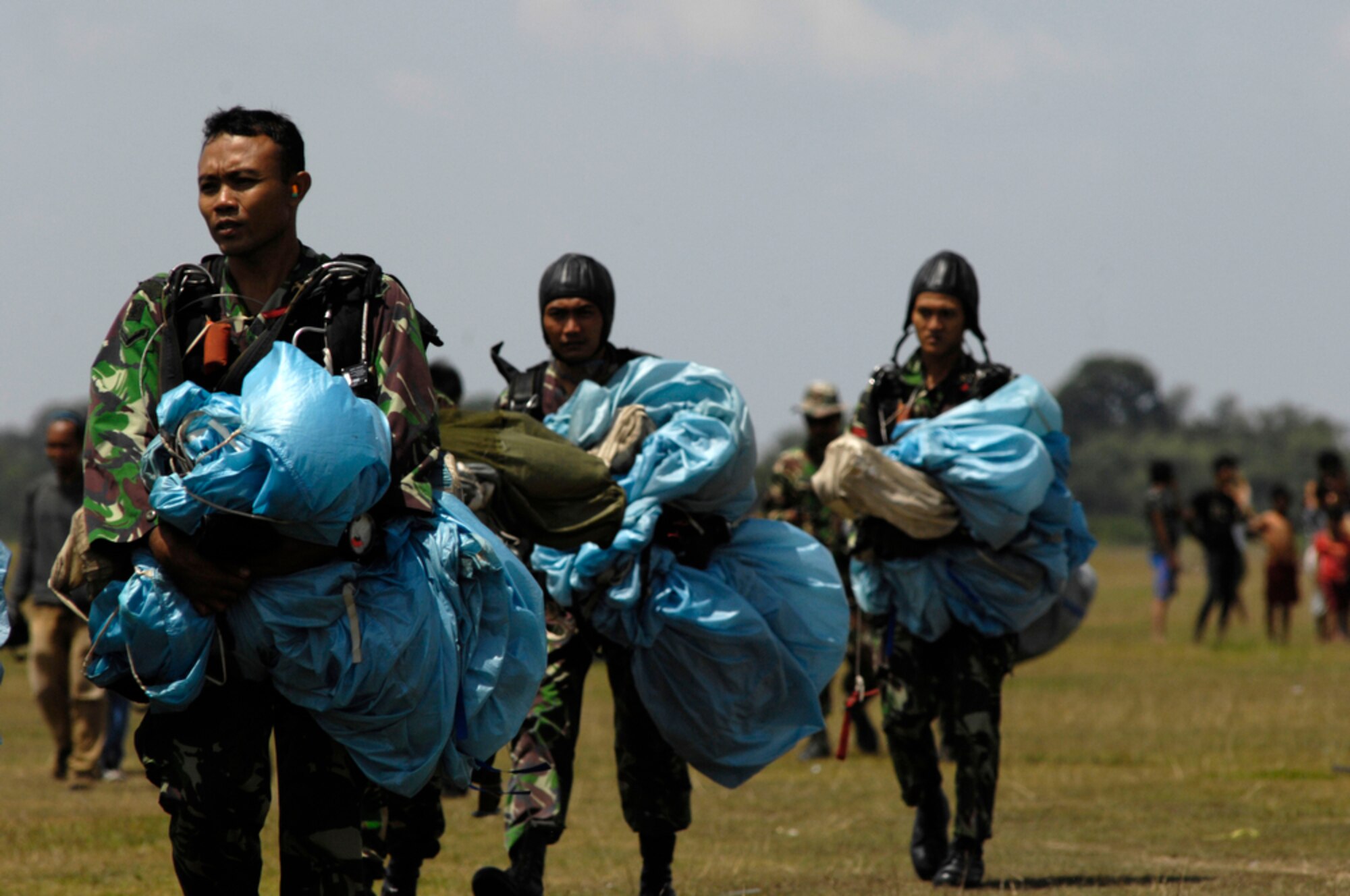 Indonesian soldiers complete a high-altitude, low-opening jump from a U.S. Air Force C-130 Hercules assigned to the 36th Airlift Squadron at Yokota Air Base, Japan, during exercise Cope West 10 in Indonesia, April 21, 2010. Cope West is a Pacific Air Forces-sponsored bilateral tactical airlift exercise involving U.S. and Indonesian air forces. The exercise is designed to advance interoperability between U.S. and Indonesian air forces, and promote cooperation and unity of purpose.  (U.S.  Air Force photo/Tech Sgt. Cohen A. Young)