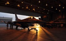 Airman Jon Casebolt and Senior Airman Troy Bledsoe, weapons load crewmembers, and Staff Sgt. Adam Hatch, weapons load crewchief, all assigned to the 8th Aircraft Maintenance Squadron's 80th Aircraft Maintenance Unit, connect an inert Joint Direct Attack Munition GBU-38 to an F-16 Fighting Falcon during Red Flag-Alaska April 19 at Eielson Air Force Base, Alaska. All of the Airmen are deployed from the 8th Fighter Wing, Kunsan Air Base, Republic of Korea. Red Flag-Alaska is a Pacific Air Forces-directed field training exercise for U.S. and coalition forces under simulated combat conditions. (U.S. Air Force photo/Capt. Shannon Collins) 