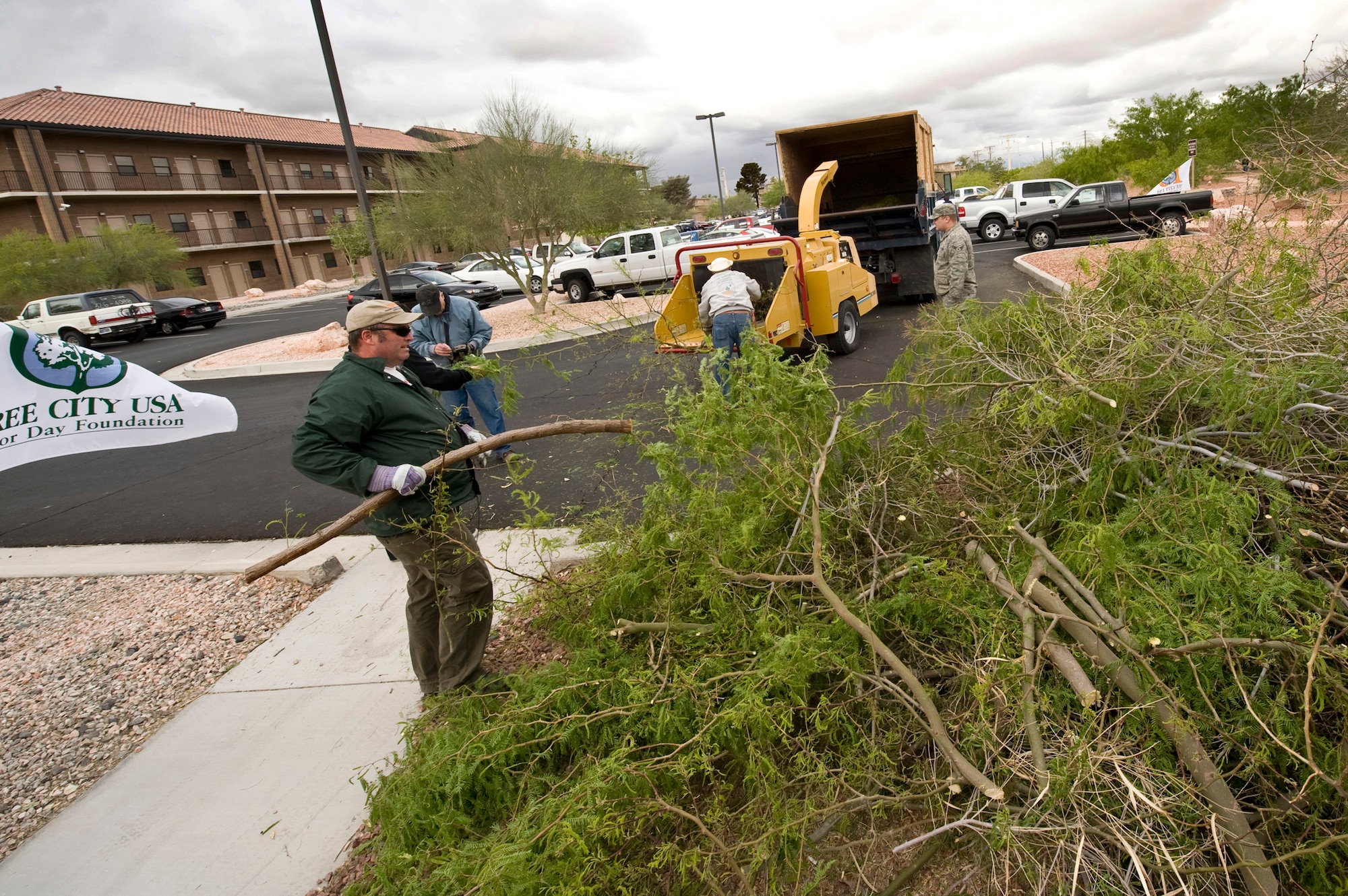 NELLIS AIR FORCE BASE, Nev -- Members from the 99th Civil Engineer Squadron Environmental Office celebrate Earth Day by pruning and shredding desert trees at the Maj. Gen. Billy McCoy Environmental Grove on Nellis April 22, 2010.  The grove showcases many natural resources in order to create environmental conservation  awareness.  (U.S. Air Force photo by Lawrence Crespo)

