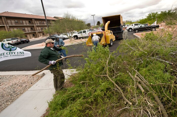 NELLIS AIR FORCE BASE, Nev -- Members from the 99th Civil Engineer Squadron Environmental Office celebrate Earth Day by pruning and shredding desert trees at the Maj. Gen. Billy McCoy Environmental Grove on Nellis April 22, 2010.  The grove showcases many natural resources in order to create environmental conservation  awareness.  (U.S. Air Force photo by Lawrence Crespo)