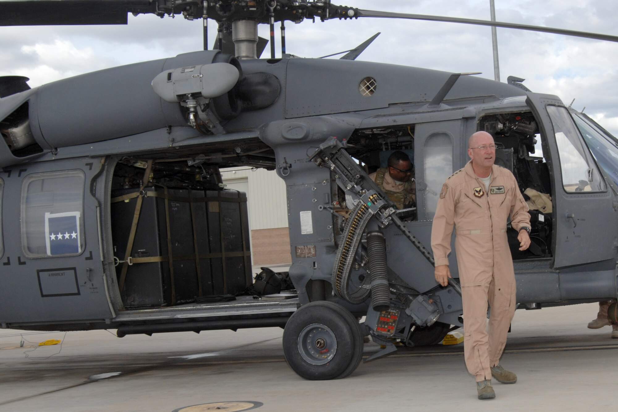 Gen. Victor E. Renuart Jr., commander of U.S. Northern Command, disembarks an HH-60 Pave Hawk on the Davis-Monthan Air Force Base flight line April 20, 2010. The general visited the base to observe Exercise Angel Thunder 2010, the largest personnel recovery exercise in the world, held annually at D-M and neighboring areas. (U.S. Air Force photo/Staff Sgt. Jake Richmond)