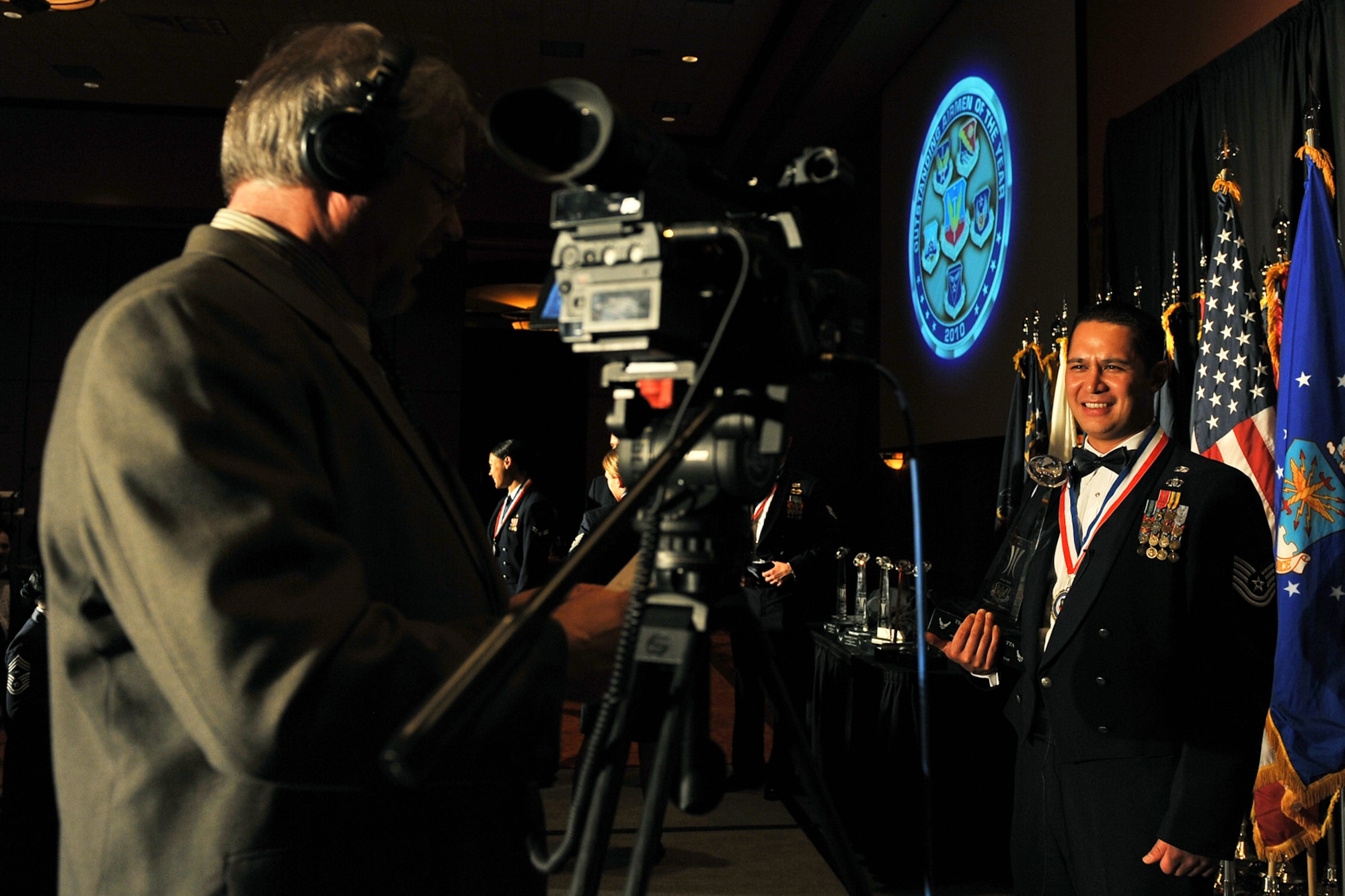 OFFUTT AIR FORCE BASE, Neb. -- Kevin Schwandt, an audio visual technician with the 55th Wing Public Affairs Office, interviews Tech. Sgt. Darrell Demotta, from Kirtland AFB, N.M., after he won Air Combat Command's Outstanding Non-commission Officer of the Year Award during ACC's Outstanding Airmen of the Year banquet at the Embassy Suites hotel in La Vista, Neb., April 21. More than 200 people attended the ceremony to honor the command's best Airmen for their dedication, sacrifice and service. U.S. Air Force photo by Charles Haymond
