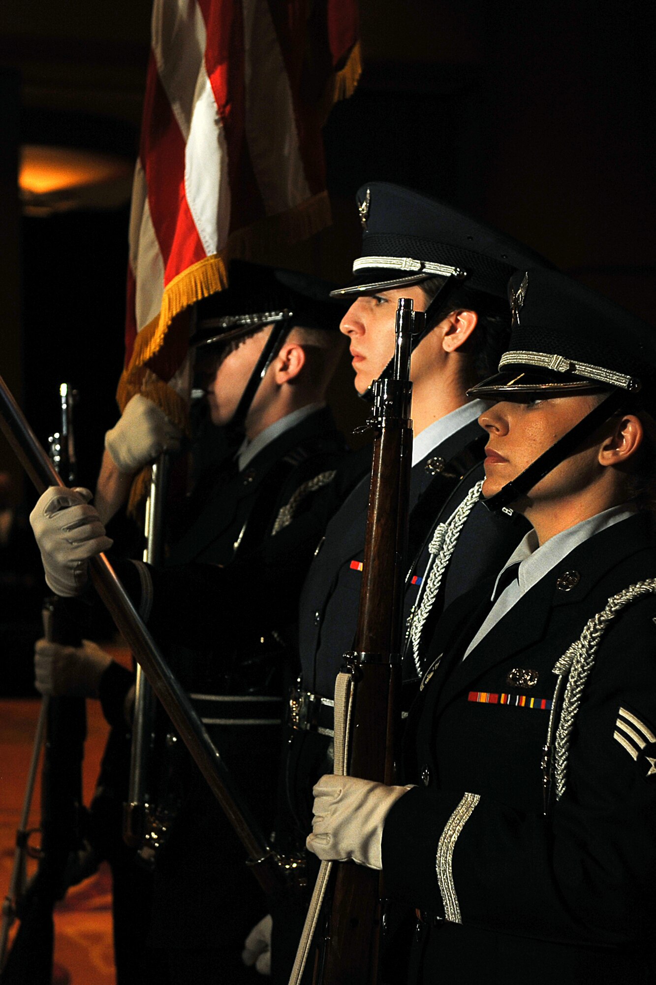 OFFUTT AIR FORCE BASE, Neb. -- Honor Guard members from various bases across Air Combat Command present the colors during the singing of the national anthem at ACC's Outstanding Airmen of the Year banquet at the Embassy Suites hotel in La Vista, Neb., April 21. More than 200 people attended the ceremony to honor the command's best Airmen for their dedication, sacrifice and service. U.S. Air Force photo by Charles Haymond