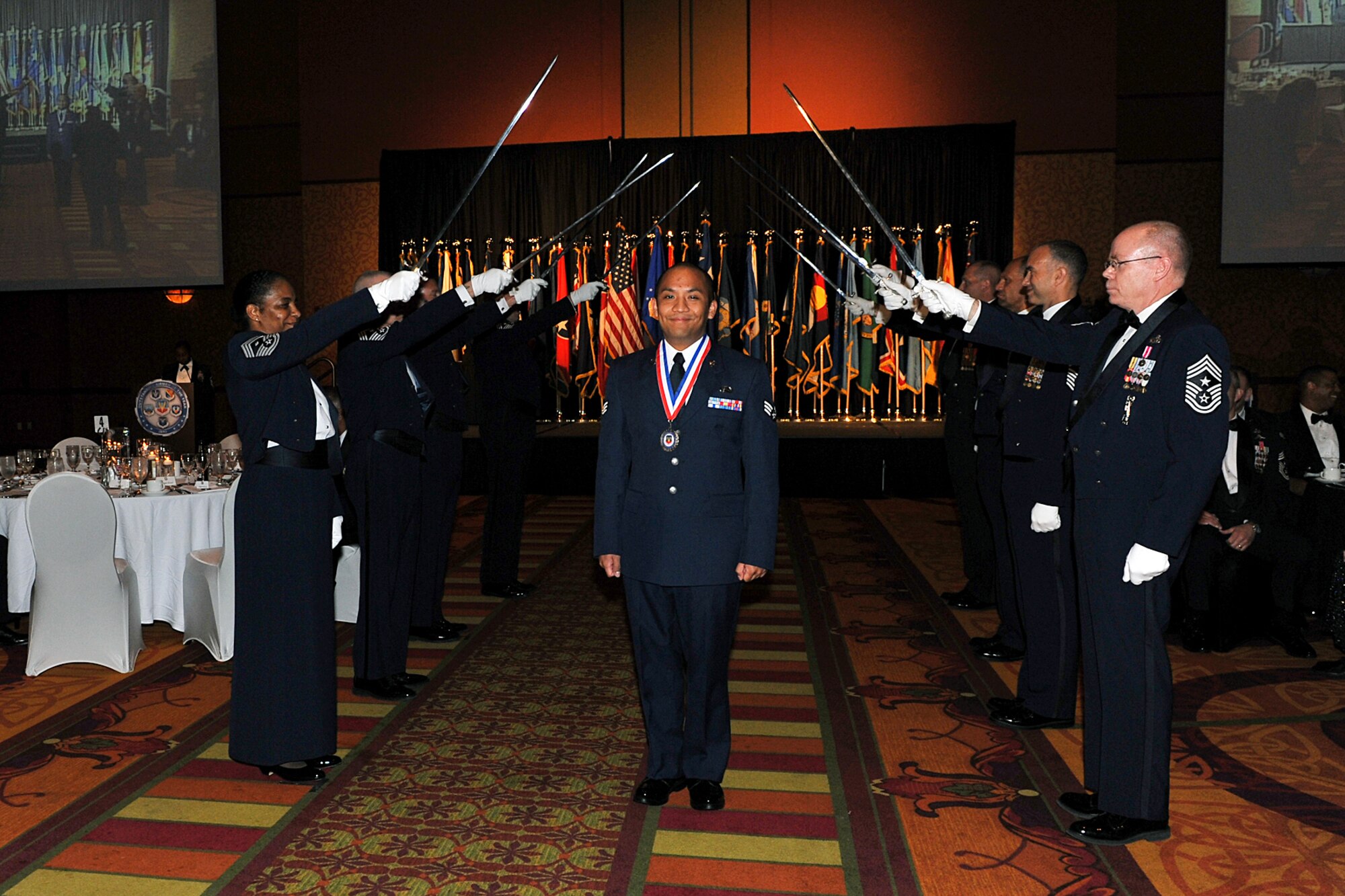 OFFUTT AIR FORCE BASE, Neb. -- Senior Airman Rojelio Voss, an intelligence analyst stationed at Tyndall AFB, Fla., was one of the first nominees to be honored at Air Combat Command's Outstanding Airmen of the Year banquet at the Embassy Suites hotel in La Vista, Neb., April 21. Airman Voss was nominated for the Outstanding Airman of the Year Award. More than 250 people attended the ceremony to honor the command's best Airmen for their dedication, sacrifice and service. U.S. Air Force Photo by Charles Haymond
