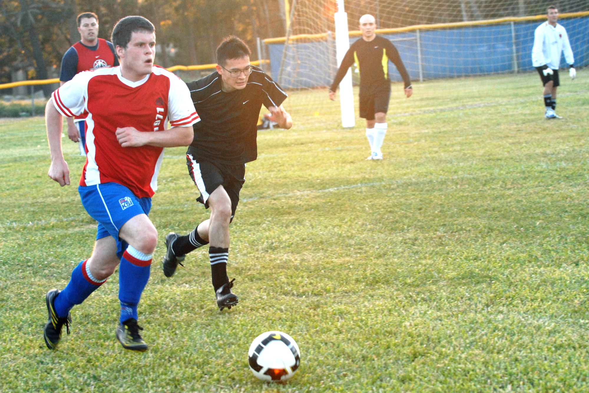 VANDENBERG AIR FORCE BASE, Calif. - Racing ahead, Frank Bocchino, a 30th Space Communications Squadron team member, gains ground as Dai Tran, a 30th Medical Group team member, fights for control of the ball during an intramural soccer game here Monday, April 19, 2010. The 30th SCS team defeated the 30th Medical Group team 8 - 3. (U.S. Air Force photo/Senior Airman Christopher Hubenthal)


