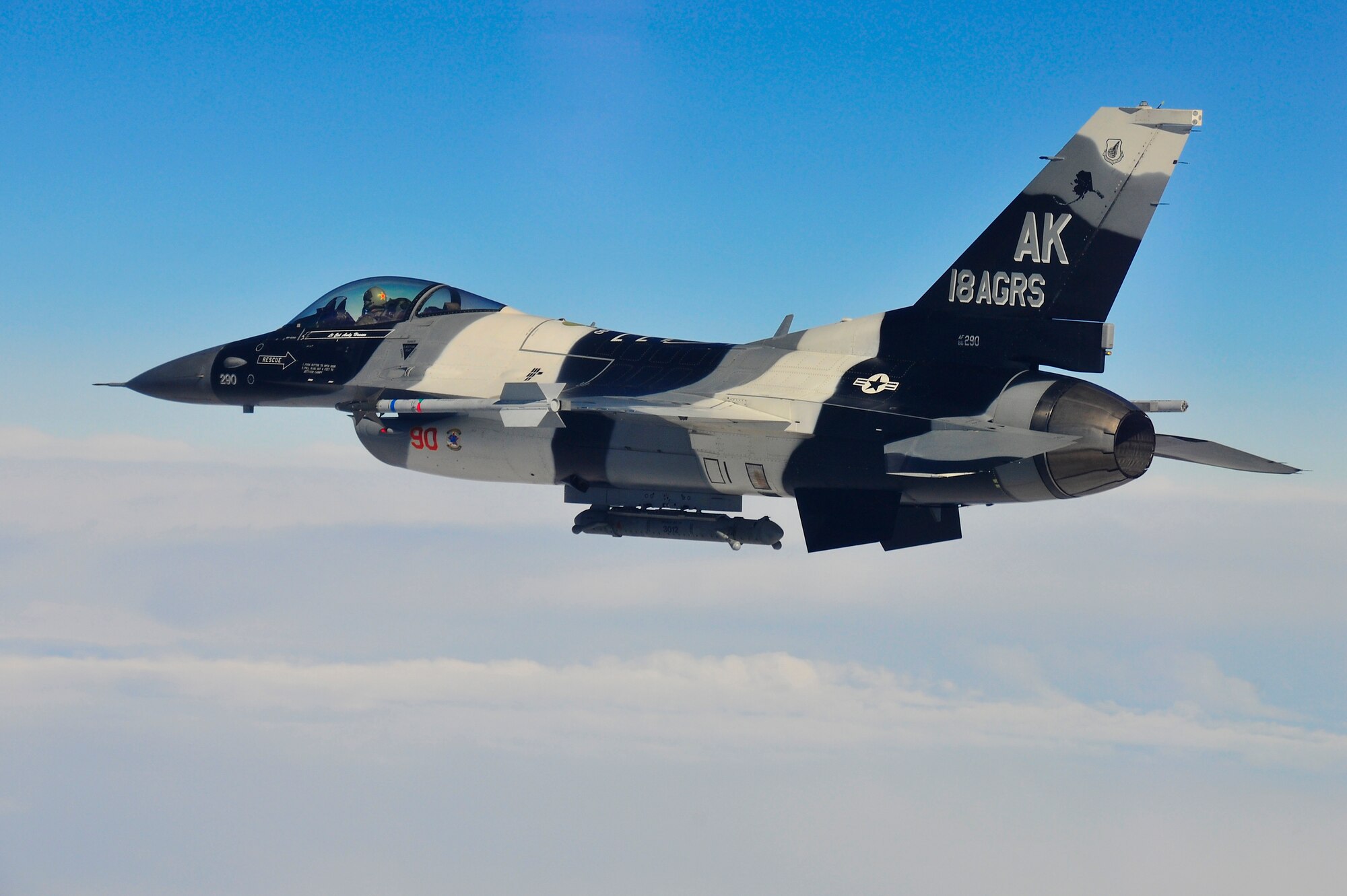 An F-16 Fighting Falcon Aggressor prepares to engage blue forces over the Alaska Range during RED FLAG-Alaska 10-2, April 20, 2010, Eielson Air Force Base, Alaska. RF-A is a Pacific Air Forces-directed field training exercise for United States and coalition forces under simulated combat conditions. The F-16 is assigned to the 18th Aggressor Squadron. (U.S. Air Force photo/Staff Sgt. Christopher Boitz)