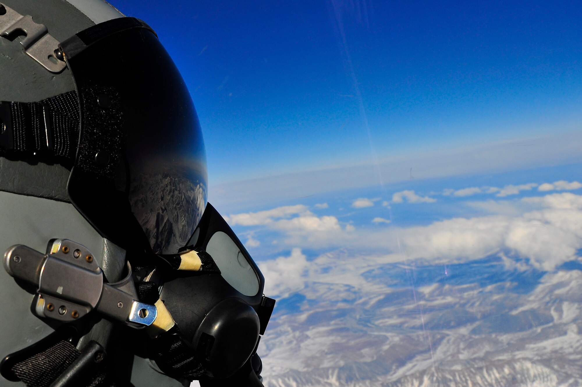 An F-16 Fighting Falcon Aggressor aircrew member looks over the Alaska Range during RED FLAG-Alaska 10-2, April 20, 2010, Eielson Air Force Base, Alaska. RF-A is a Pacific Air Forces-directed field training exercise for United States and coalition forces under simulated combat conditions. The F-16 is assigned to the 18th Aggressor Squadron. (U.S. Air Force photo/Staff Sgt. Christopher Boitz)