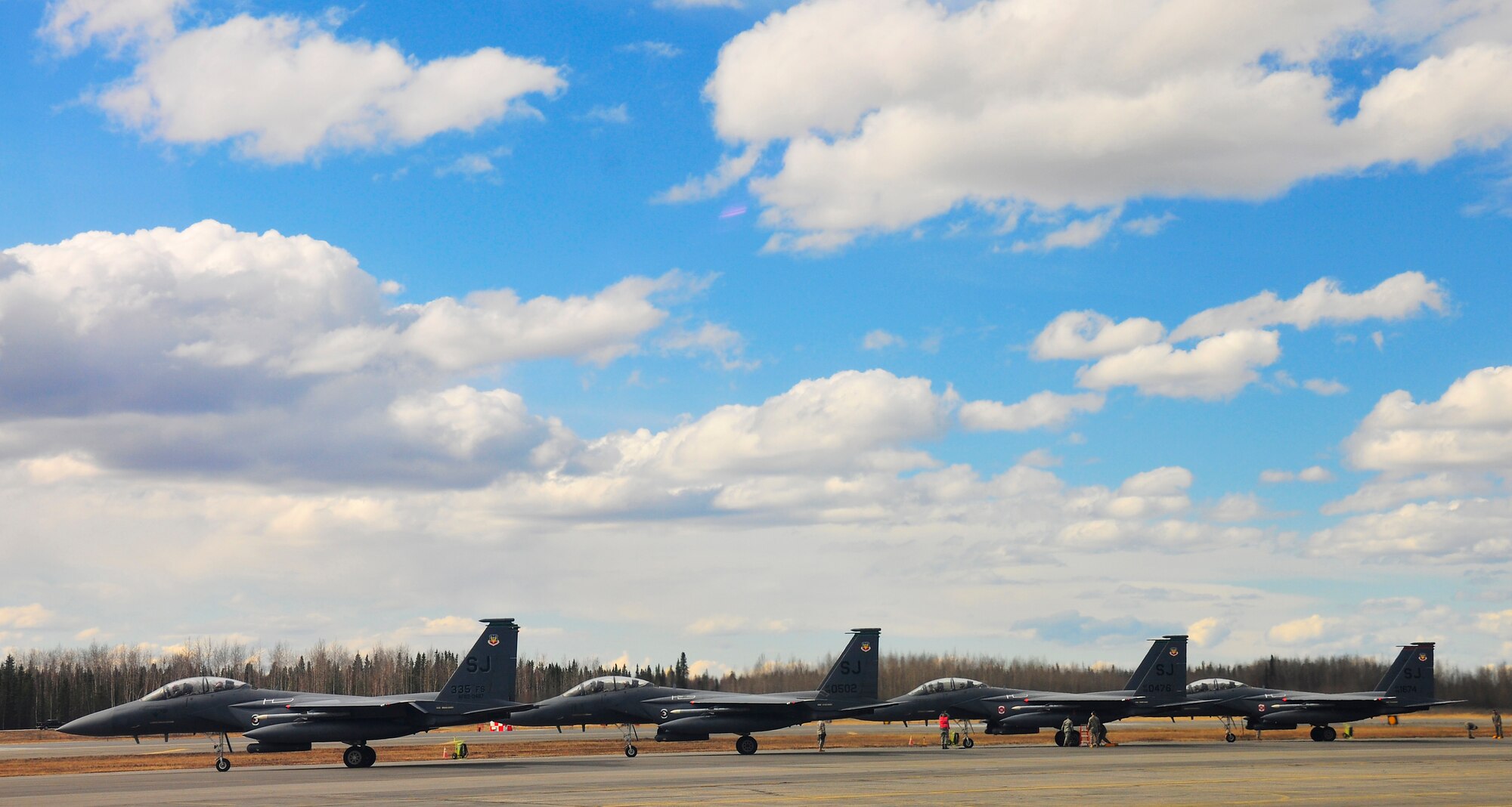 F-15E Strike Eagles get final checks prior to launching during RED FLAG-Alaska 10-2, April 20, 2010, Eielson Air Force Base, Alaska. RF-A provides participants 67,000 square miles of airspace, more than 30 threat simulators, one conventional bombing range and two tactical bombing ranges containing more than 400 different types of targets. The Strike Eagles are assigned to Seymour Johnson AFB, N.C. (U.S. Air Force photo/Staff Sgt. Christopher Boitz)