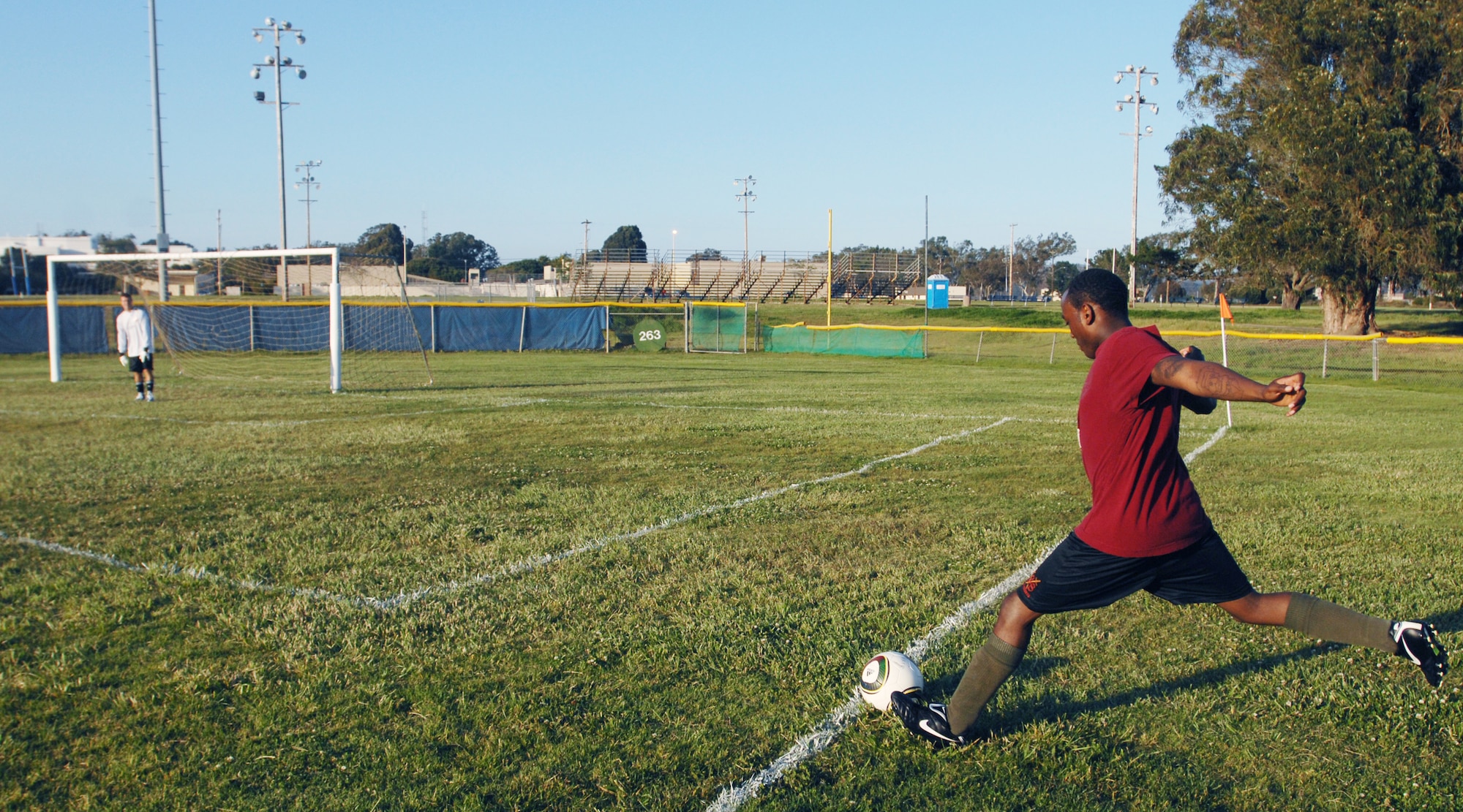 VANDENBERG AIR FORCE BASE, Calif. - Isaac Cunningham, a 30th Space Communications Squadron team member, prepares to kick the ball back into play during an intramural soccer game here Monday, April 19, 2010. The 30th SCS team defeated the 30th Medical Group team 8 - 3. (U.S. Air Force photo/Senior Airman Christopher Hubenthal)
