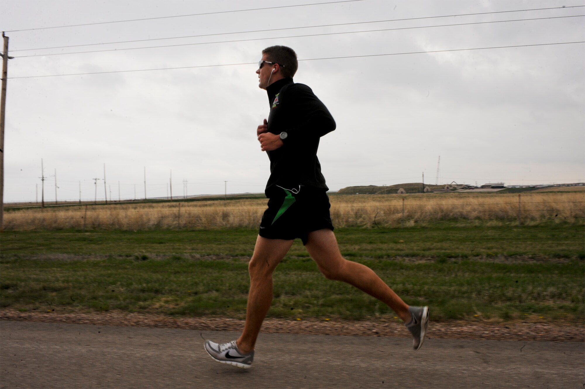Capt. Edward Rozak, 28th Operations Support Squadron weather flight commander, runs in the Ellsworth Earth Day 5K, April 22. Out of forty-seven participants, Captain Rozak won the event with a time of 21-minutes and 51-seconds. (U.S. Air Force photo/Senior Airman Adam Grant) 