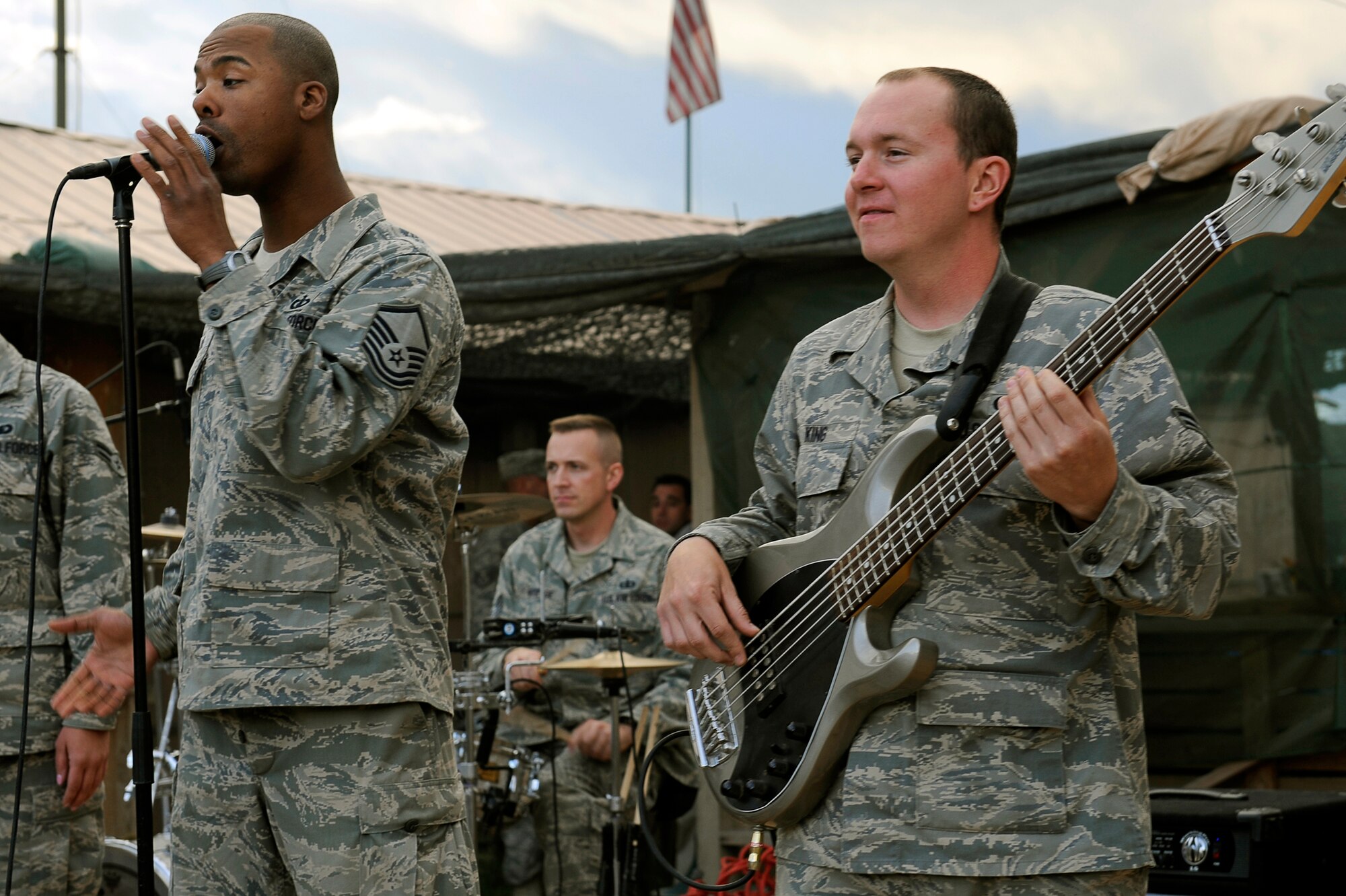 Members of the Air Forces Central Expeditionary Band, Reserve Generation Master Sgt. Aaron Miles, Airman 1st Class Darren King (left to right) and Tech. Sgt. David Vittetoe (back) perform April 18, 2010, at Bagram Airfield, Afghanistan. (U.S. Air Force photo by/Tech. Sgt. Jeromy K. Cross)


