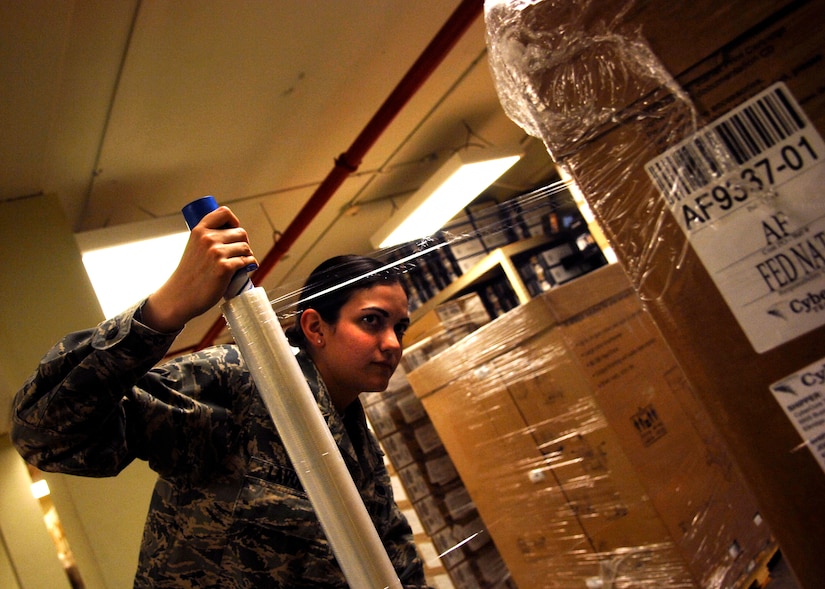 Airman 1st Class Cassandra LaVoie wraps a recently packed box for delivery to the Defense Re-utilization and Marketing Office at the Automatic Data Processing Equipment warehouse April 20, 2010, on Joint Base Charleston, S.C. The equipment being shipped goes to the DRMO located on Fort Jackson, S.C. Airman LaVoie is an Information Technology Asset Manager for the 628th Communications Squadron. (U.S. Air Force photo/Senior Airman Timothy Taylor)

