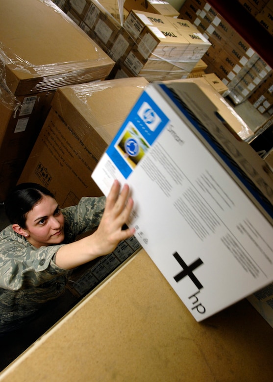 Airman 1st Class Cassandra LaVoie retrieves ink cartridges at the request of a customer to refill their printer at the Automatic Data Processing Equipment warehouse April 20, 2010, on Joint Base Charleston, S.C. The ADPE office is responsible for issuing out computer equipment and handling smaller orders for items like ink cartridges for printers. Airman LaVoie is an Information Technology Asset Manager for the 628th Communications Squadron. (U.S. Air Force photo/Senior Airman Timothy Taylor)