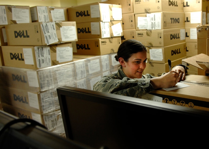 Airman 1st Class Cassandra LaVoie fills out a temporary issue receipt for a computer at the Automatic Data Processing Equipment warehouse April 20, 2010, on Joint Base Charleston, S.C. The ADPE office is responsible for distributing new or refurbished computers and collecting out of date computers for all the Air Force Personnel. Airman LaVoie is an Information Technology Asset Manager for the 628th Communications Squadron. (U.S. Air Force photo/Senior Airman Timothy Taylor)