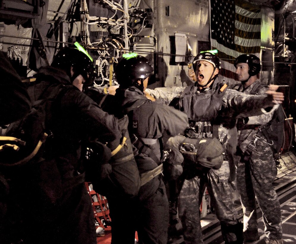 Master Sgt. Lyle Michael signals the students to prepare to jump from the C-130J Super Hercules April 12, 2010, over Key West, Fla.  (U.S. Air Force photo/Tech. Sgt. Tanya King)