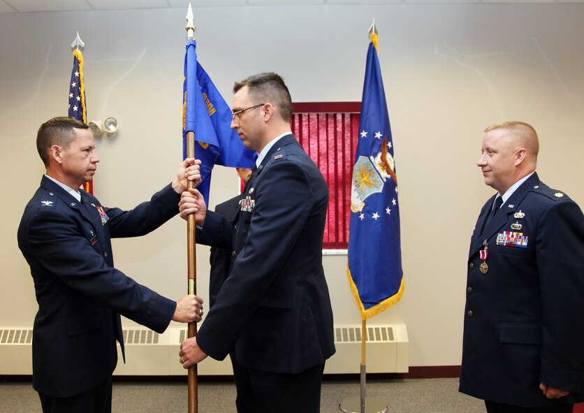 Col. James B. Hurley, 911th Mission Support Group commander, appoints Capt. Scott M. Dieffenback with the position of squadron commander for the 911th Communications Squadron. Maj. John T. McMahon relinquishes command.