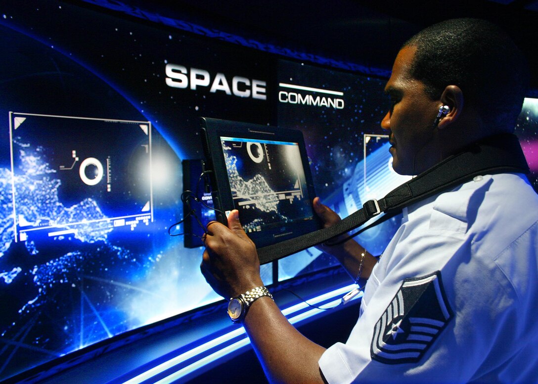 Master Sgt. Rich Davis, Air Force Recruiting Service, checks out Command Center Alpha, the Air Force's newest mobile marketing tour. A first-of-its-kind augmented reality mobile tour experience, Command Center Alpha immerses visitors in the "sci-fi" world of the U.S. Air Force. The interactive tour includes 3-D computer graphics, videos, educational kiosks, digital downloads and a full-size F-16 Thunderbird display. (U.S. Air Force photo/Dale Eckroth)