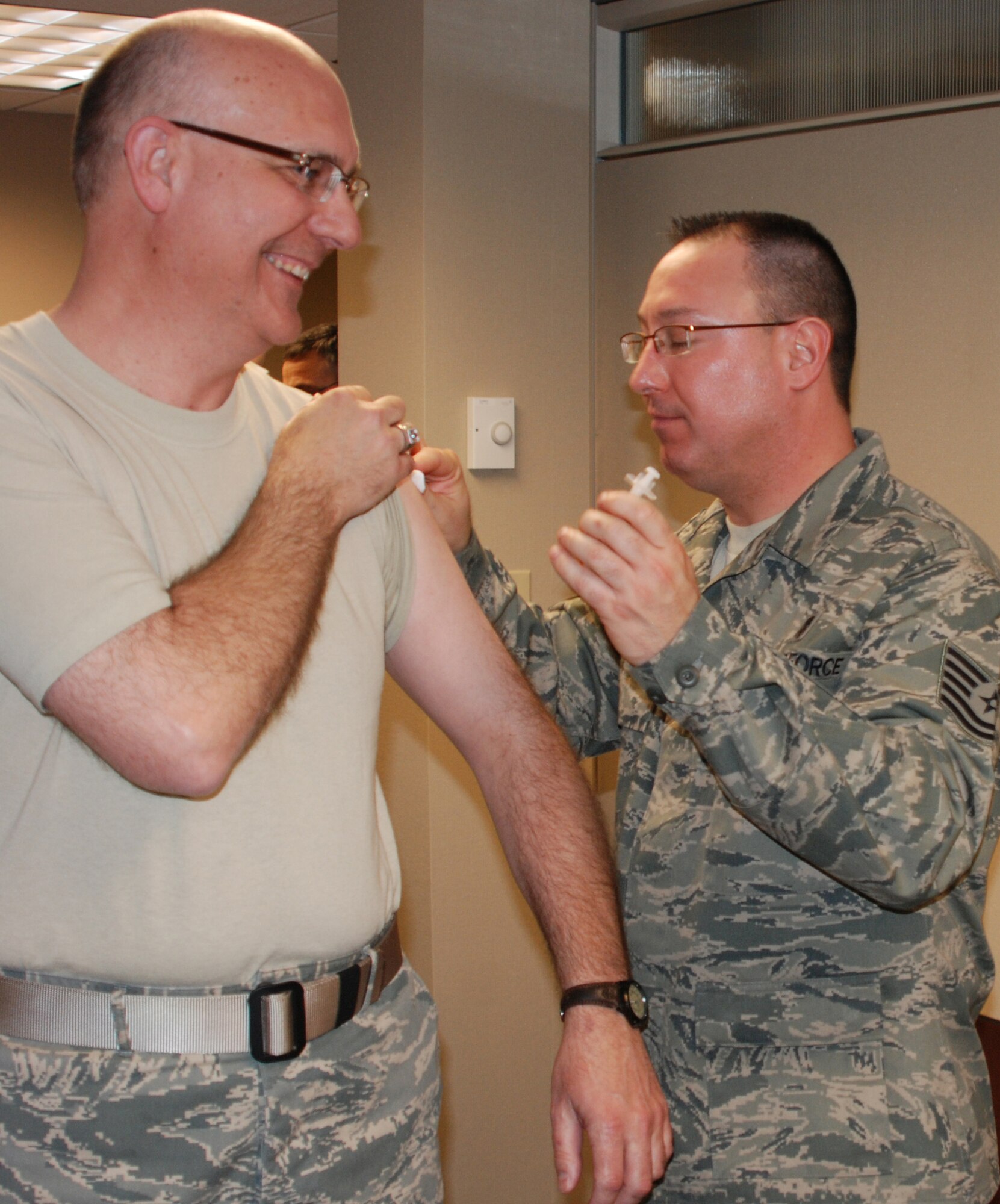 Lt. Col. Fred Hahn gets his flu shot during a 932nd Airlift Wing Unit Training Assembly to maintain his worldwide readiness.  Members of the Air Force Reserve Command wing in Illinois are constantly preparing for exercises and actual deployments.  (U.S. Air Force photo/Maj. Stan Paregien)