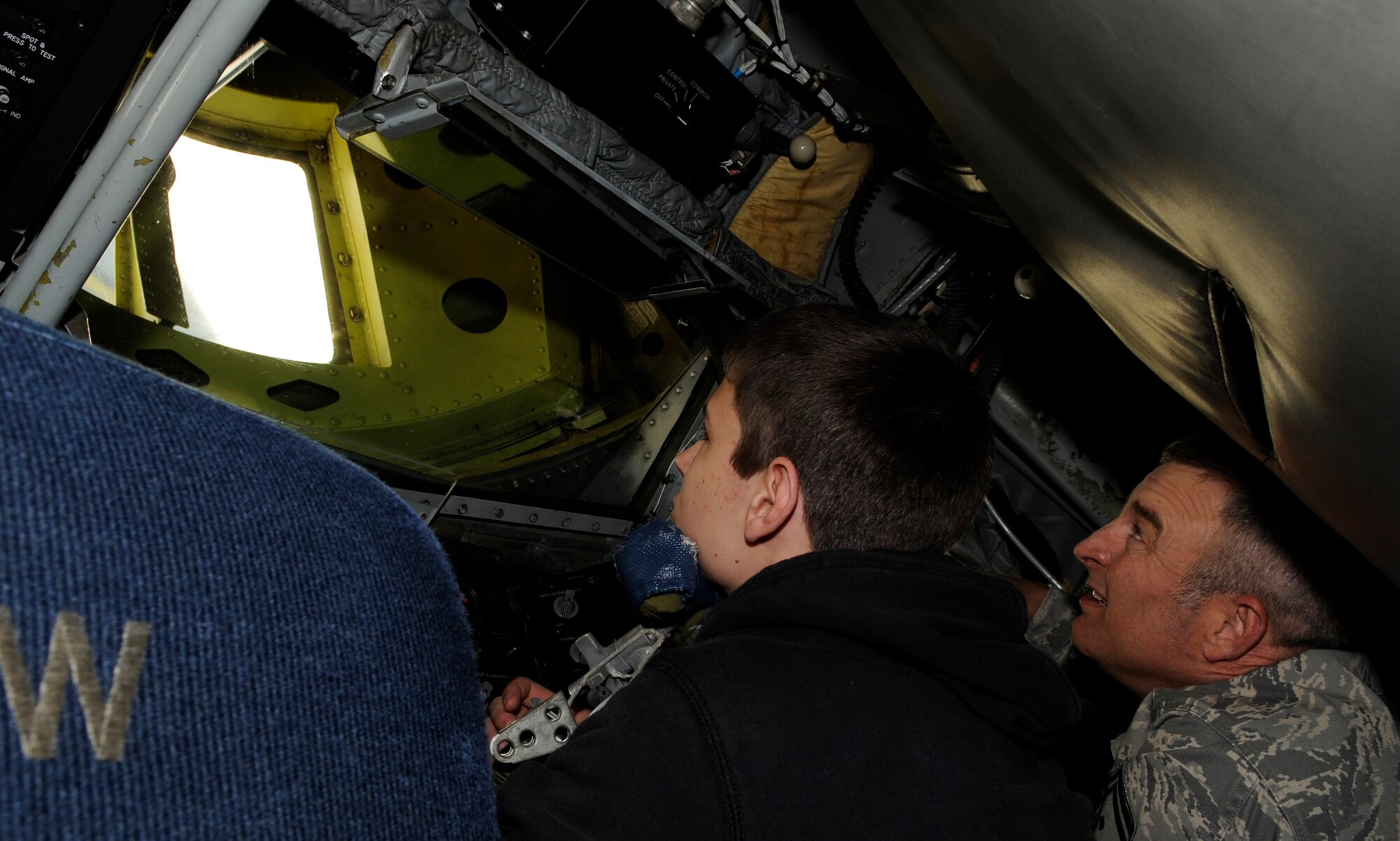 RAF MILDENHALL, England – Senior Master Sgt. Kevin Hawks, 100th Logistics Readiness Squadron, and his son Garrett, check out the refueling boom controls on a KC-135 Stratotanker April 22.  The display was part of “Bring Your Child to Work Day,” an event designed to show children their parent’s job.  (U.S. Air Force photo/Staff Sgt. Christopher L. Ingersoll)