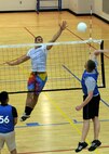 MINOT AIR FORCE BASE, N.D. – Airman 1st Class Weston Whitsett, 5th Operations Support Squadron air traffic controller, spikes the ball during an intramural volleyball match at the McAdoo Sports and Fitness Center at Minot AFB April 20. The intramural volleyball season runs from April 8 to May 6. (U.S. Air Force photo by Senior Airman Sharida Jackson)