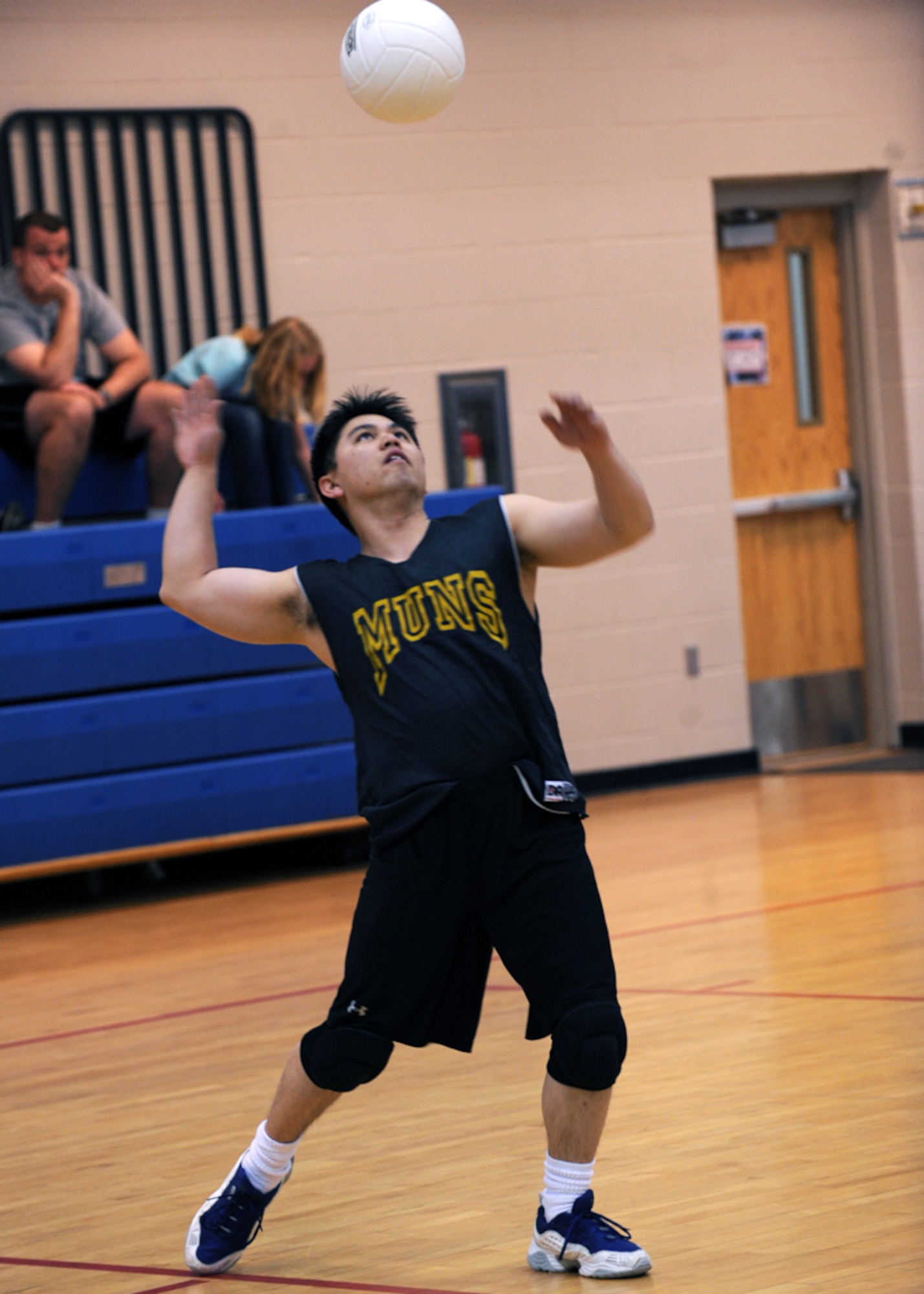 MINOT AIR FORCE BASE, N.D. – Tech. Sgt. Terry Quijano, 17th Munitions Squadron missile maintenance team chief, serves the ball during an intramural volleyball match at the McAdoo Sports and Fitness Center at Minot AFB April 20. The intramural volleyball season runs from April 8 to May 6. (U.S. Air Force photo by Senior Airman Sharida Jackson)