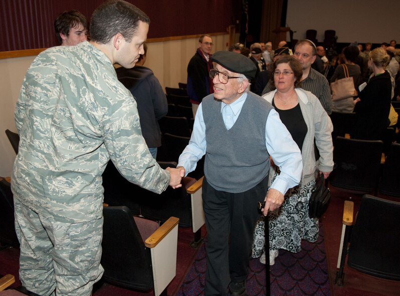 HANSCOM AIR FORCE BASE, Mass. -- Following Hanscom’s Holocaust memorial event, keynote speaker Morris Salzberg (center), greets members of the Hanscom community as he exits the Base Theater. Mr. Salzberg, a Holocaust survivor who spent a year in the Auschwitz-Birkenau death camp, spoke to the audience about his experiences during the Holocaust and after World War II.  (U.S. Air Force photo by Rick Berry) 