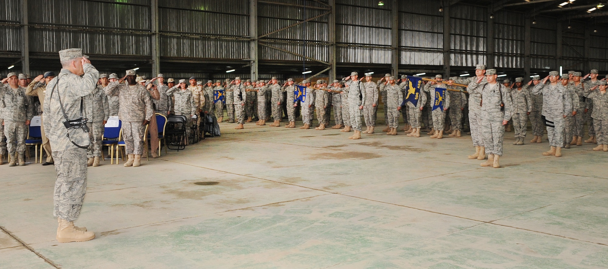 Col. Steven Slick, 506th Air Expeditionary Group commander, receives his first salute from the men and women of the 506th AEG during the change of command ceremony at Kirkuk Regional Air Base, Iraq on April. 22, 2010.   Col. Slick is deployed from Dobbins Air Reserve Base, Ga., where he serves as the commander of the 94th Mission Support Group.  (U.S. Air Force photo/Staff Sgt. Tabitha Kuykendall/Released)	  