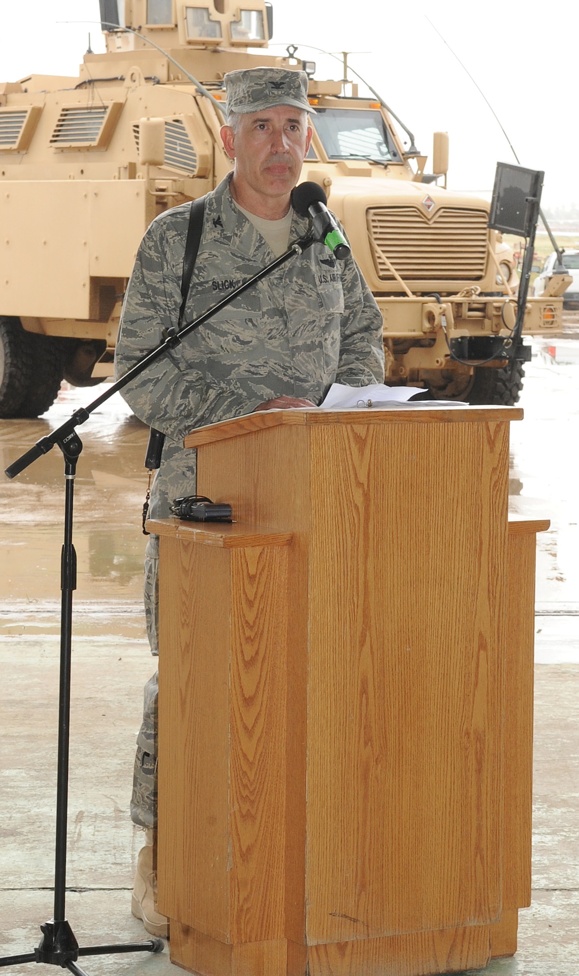 Col. Steven Slick, 506th Air Expeditionary Group commander, addresses the men and women of the 506th AEG during the change of command ceremony at Kirkuk Regional Air Base, Iraq on April 22, 2010.   Col. Slick is deployed from Dobbins Air Reserve Base, Ga., where he serves as the commander of the 94th Mission Support Group.  (U.S. Air Force photo/Staff Sgt. Tabitha Kuykendall/Released)	 