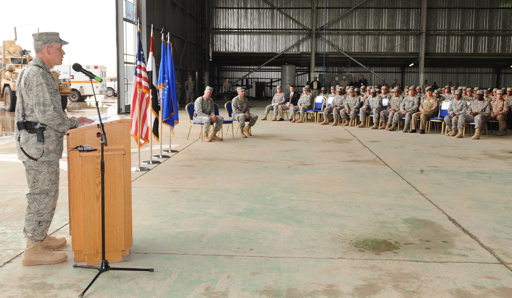 Col. Steven Slick, 506th Air Expeditionary Group commander, addresses the men and women of the 506 AEG during the change of command ceremony at Kirkuk Regional Air Base, Iraq on April. 22, 2010.   Colonel Slick is deployed from Dobbins Air Reserve Base, Ga., where he serves as the commander of the 94th Mission Support Group.  (U.S. Air Force photo/Staff Sgt. Tabitha Kuykendall/Released)