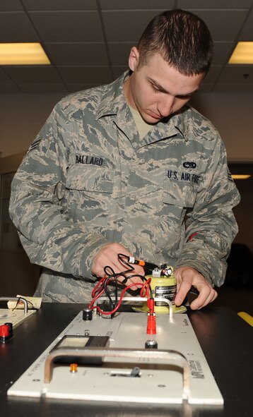 SEYMOUR JOHNSON AIR FORCE BASE, N.C. -- Senior Airman William Ballard tests an aerial refueling flood light here April 20, 2010. The flood light provides light to a refueling receptacle on an F-15E Strike Eagle during aerial refueling night missions. Airman Ballard, 4th Component Maintenance Squadron electrical and environmental journeyman, hails from Houston. (U.S. Air Force photo/Airman 1st Class Gino Reyes)