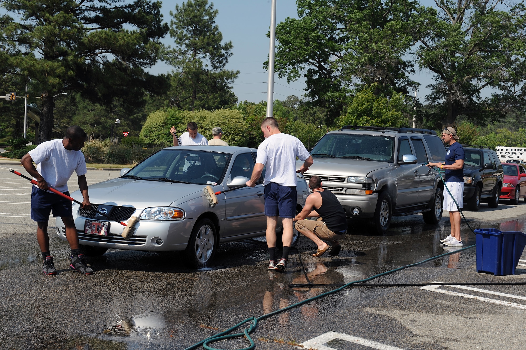 SEYMOUR JOHNSON AIR FORCE BASE, N.C. -- Firefighters from the 4th Civil Engineer Squadron wash cars to raise money for Wayne Action Teams for Community Health here April 16, 2010. The WATCH mission is to guide a process for improving the health of the Wayne County community. (U.S. Air Force photo/Senior Airman Whitney Lambert) 

