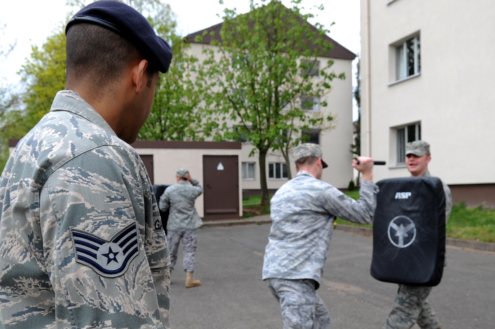 U.S. Air Force Staff Sgt. Rodney Gattis, 435th Security Forces Squadron creek defender instructor, observes as Airmen participate in ASP Baton training, Sembach Annex, Germany, April 21, 2010. The ASP Baton training was part of Unites States Air Forces in Europe's first ever Fly Away Security Team class. (U.S. Air Force photo by Airman 1st Class Grovert Fuentes-Contreras)