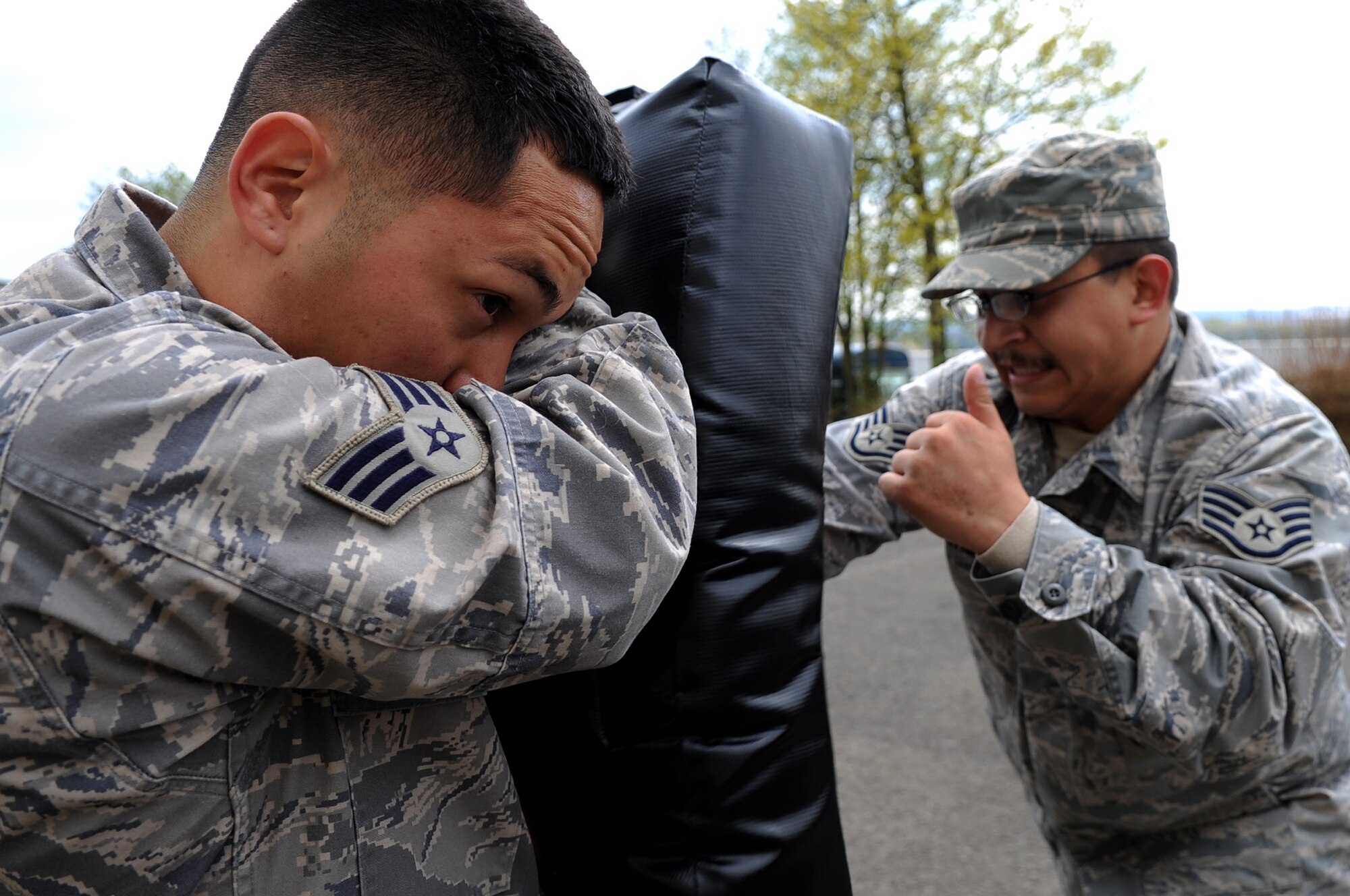 U.S. Air Force Senior Airman Jose Mejia and Staff Sgt. Herman Gabaldon, 435th Security Forces Squadron, participate in ASP Baton training, Sembach Annex, Germany, April 21, 2010. The ASP Baton training was part of Unites States Air Forces in Europe's first ever Fly Away Security Team class. (U.S. Air Force photo by Airman 1st Class Grovert Fuentes-Contreras)