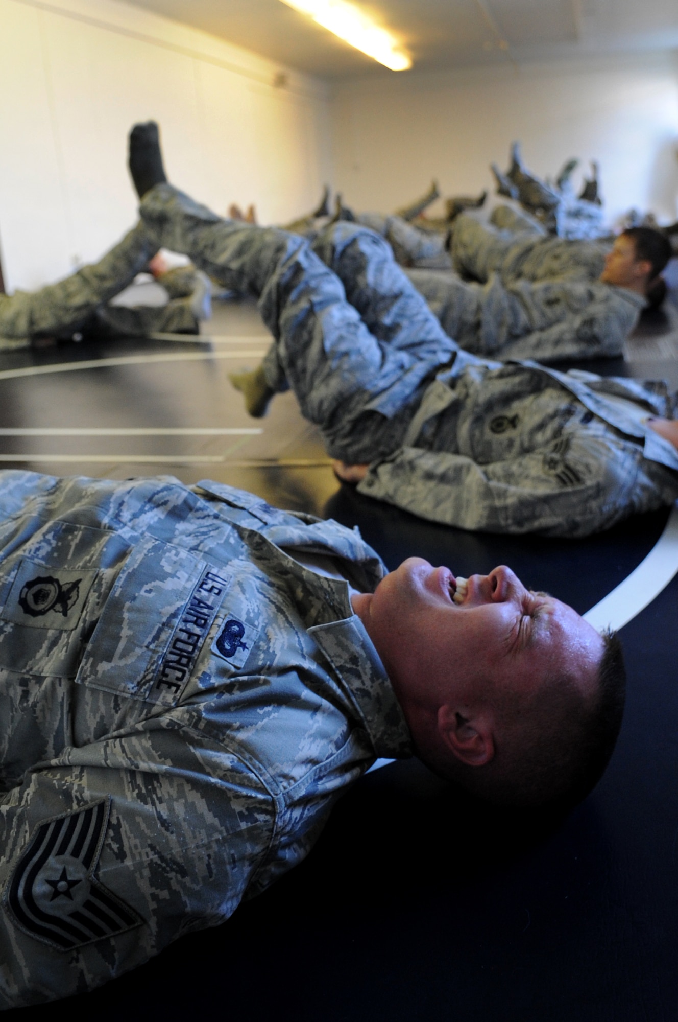 U.S. Air Force Tech. Sgt. Erik Flanagan, 569th Security Forces Squadron, struggles through a modified army combative training, Sembach Annex, Germany, April 21, 2010. The army combative course was part of Unites States Air Forces Europe's first ever Fly Away Security Team class. (U.S. Air Force photo by Airman 1st Class Grovert Fuentes-Contreras)