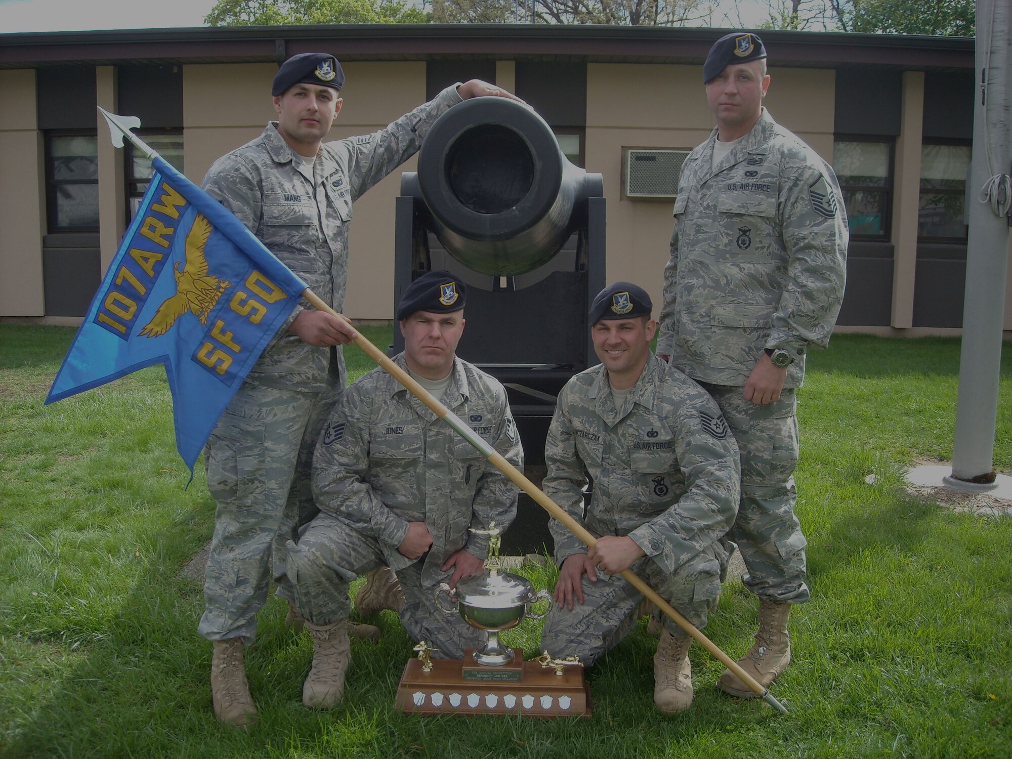 Camp Smith-- Members of the 107th Security Forces Squadron marksmanship team who won the combined arms trophy at the 31st annual TAG Match shooting compettion at Camp Smith April 16-18 pose with their trophy. From left to right; Staff Sgt. Ryan Mang, Staff Sgt. Warren Jones, Tech. Sgt. Daniel Owczarczak and Master Sgt. Edward Stefik. (Courtesy photo)