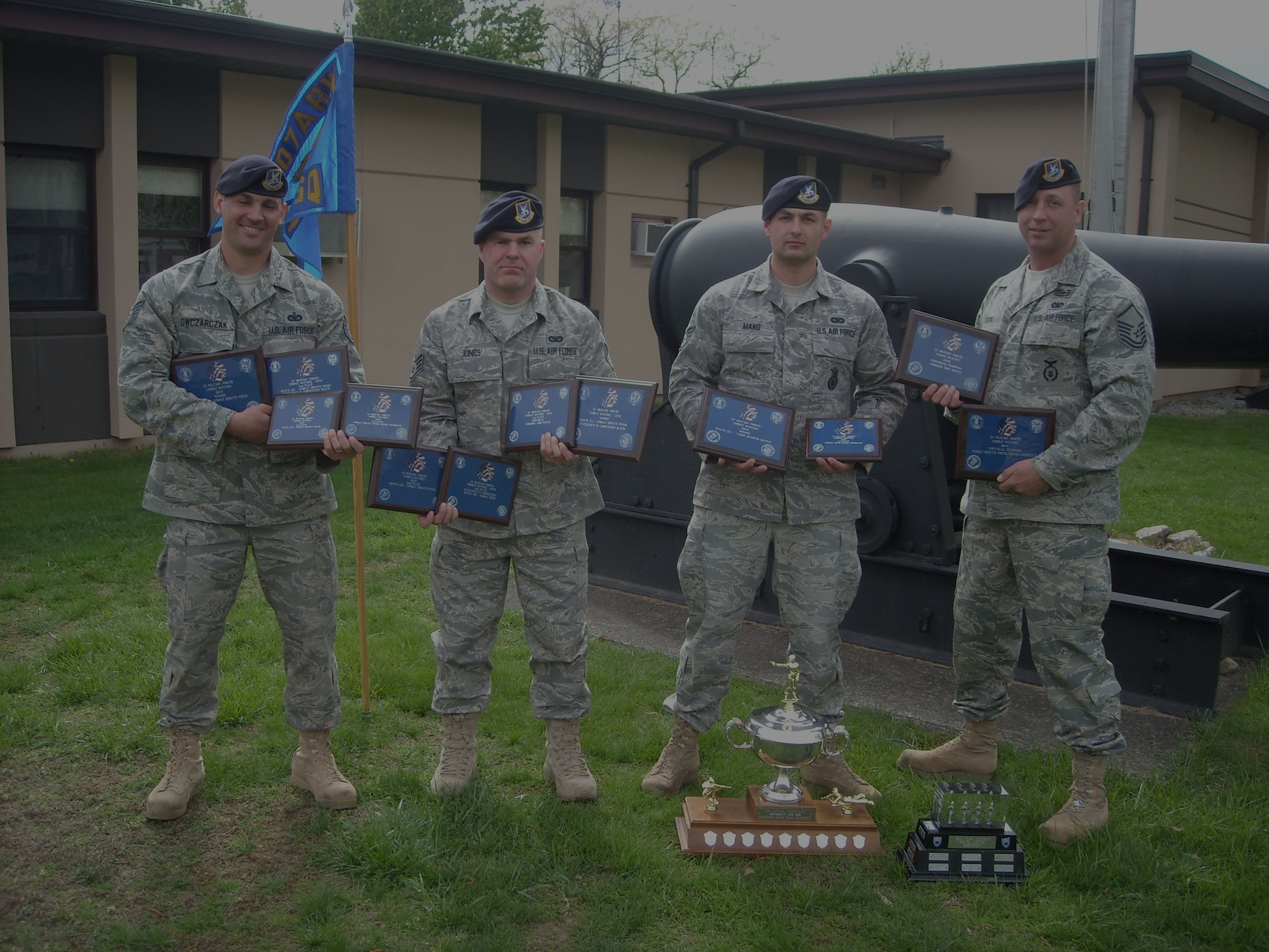 Camp Smith-- Members of the 107th Security Forces Squadron marksmanship team who won the combined arms trophy at the 31st annual TAG Match shooting compettion at Camp Smith April 16-18 pose with their many awards. The  individuals from the 107th shooting team won or placed in many individual events giving them the points they needed to bring home the title of New York state TAG 2010 Combined Arms Team Champions. From left to right; Tech. Sgt. Daniel Owczarczak , Staff Sgt. Warren Jones, Staff Sgt. Ryan Mang and Master Sgt. Edward Stefik. (Courtesy Photo)