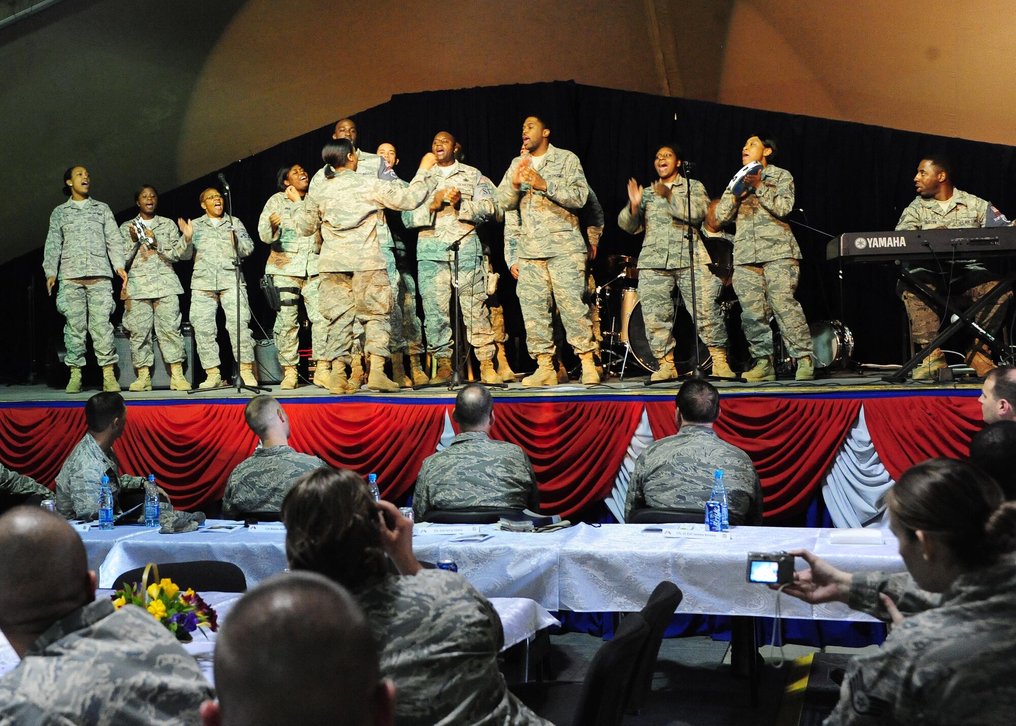 The Gospel choir sings during the National Prayer Luncheon at the Transit Center at Manas, Kyrgyzstan, April 21, 2010. U.S. Air Forces Central Command Chaplain, Col. Jerry Lewis, presided over the ceremony speaking on ?Hope in times like these.? (U.S. Air Force photo/ Senior Airman Nichelle Anderson/ released)