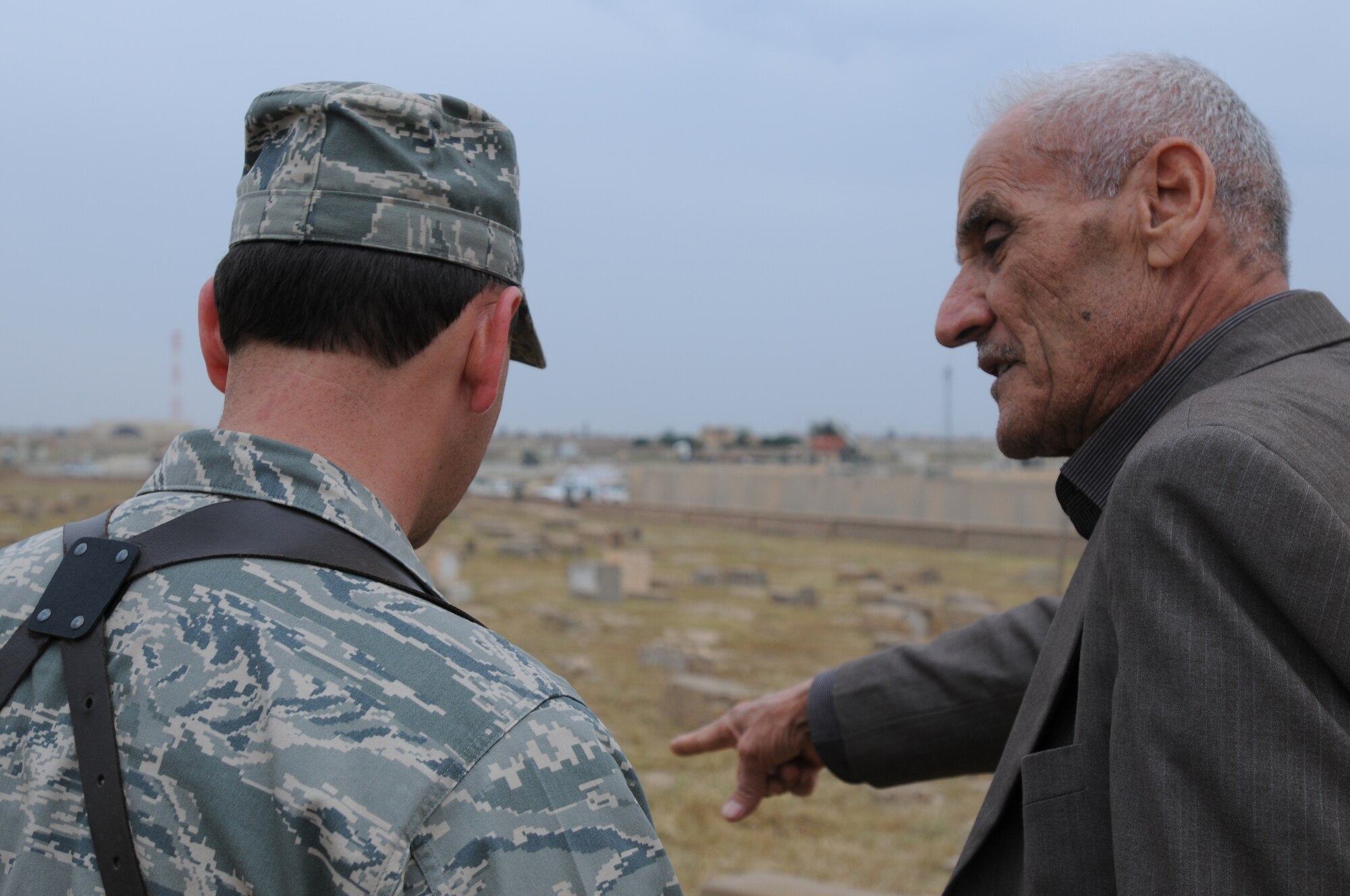 Lt. Col. Bruce Finley, 506th Air Expeditionary Group vice commander talks with a gentleman from the Turkmen Shi’a community during a visit of the Sultan Saqi Shrine April 17, 2010 on Kirkuk Regional Air Base, Iraq. (U.S. Air Force photo/Master Sgt. Martie Moore)